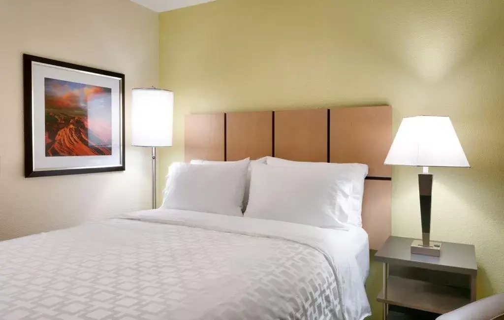 Bed in Candlewood Suites Plano East, an IHG Hotel