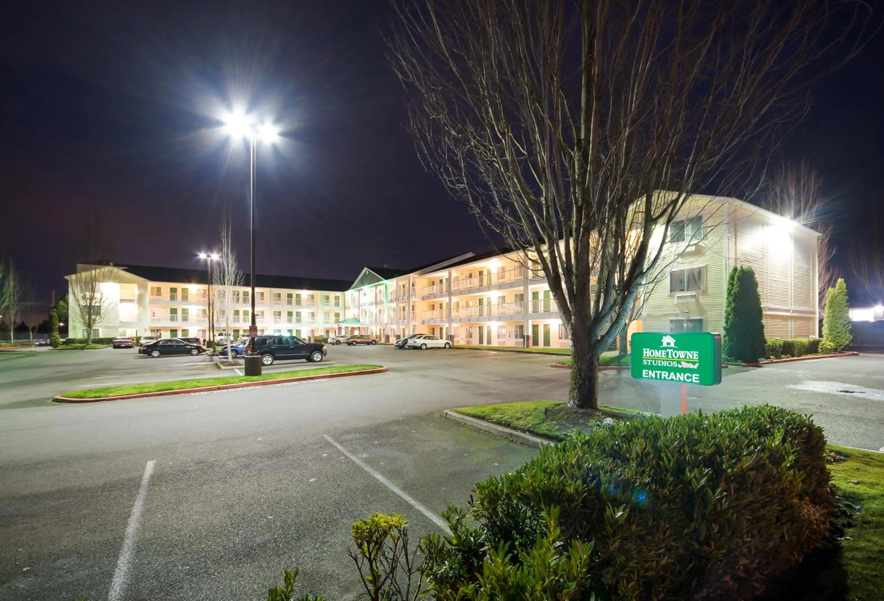 Property building in HomeTowne Studios by Red Roof Seattle - Kent/Des Moines