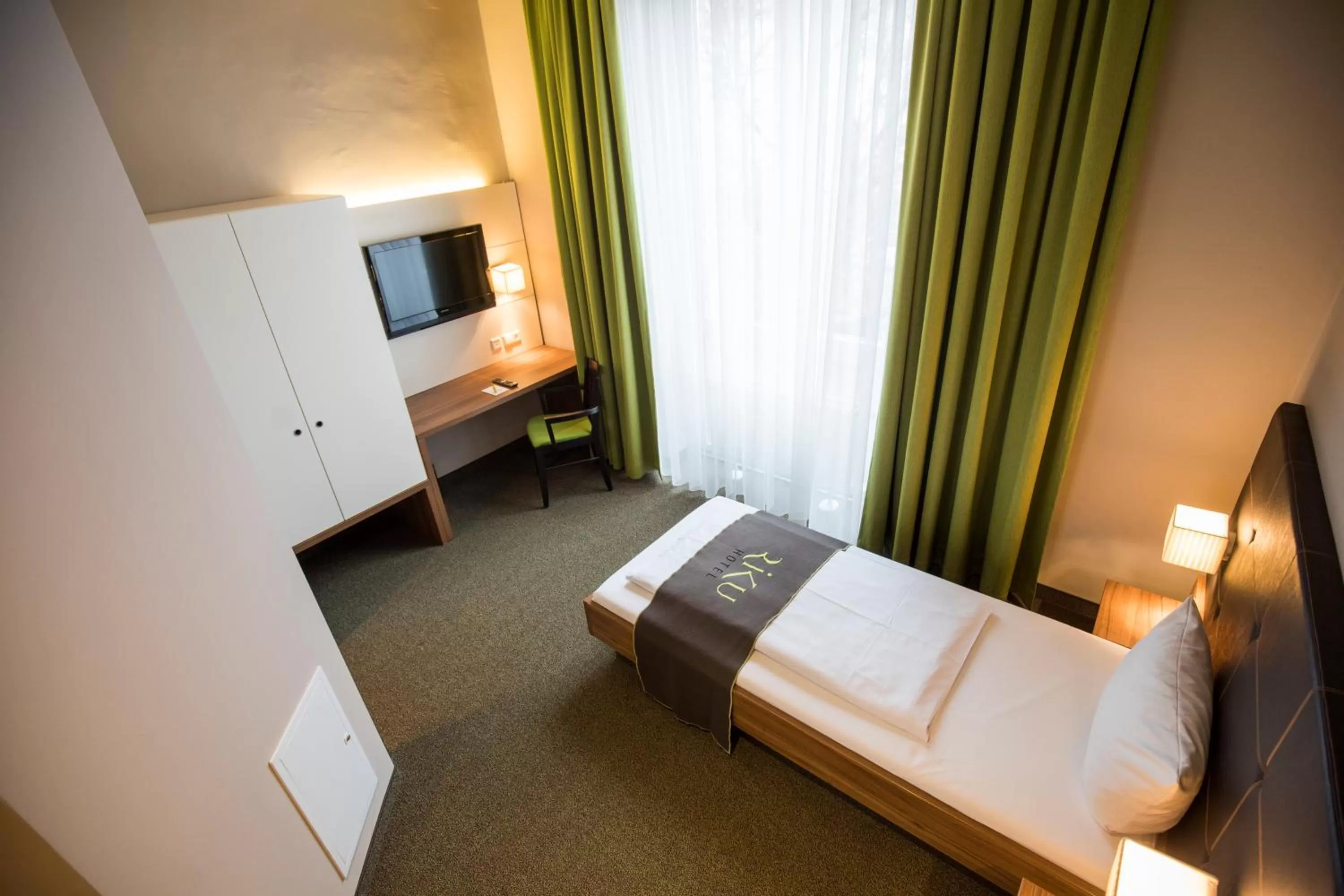 Photo of the whole room, Bed in RiKu HOTEL Neu-Ulm