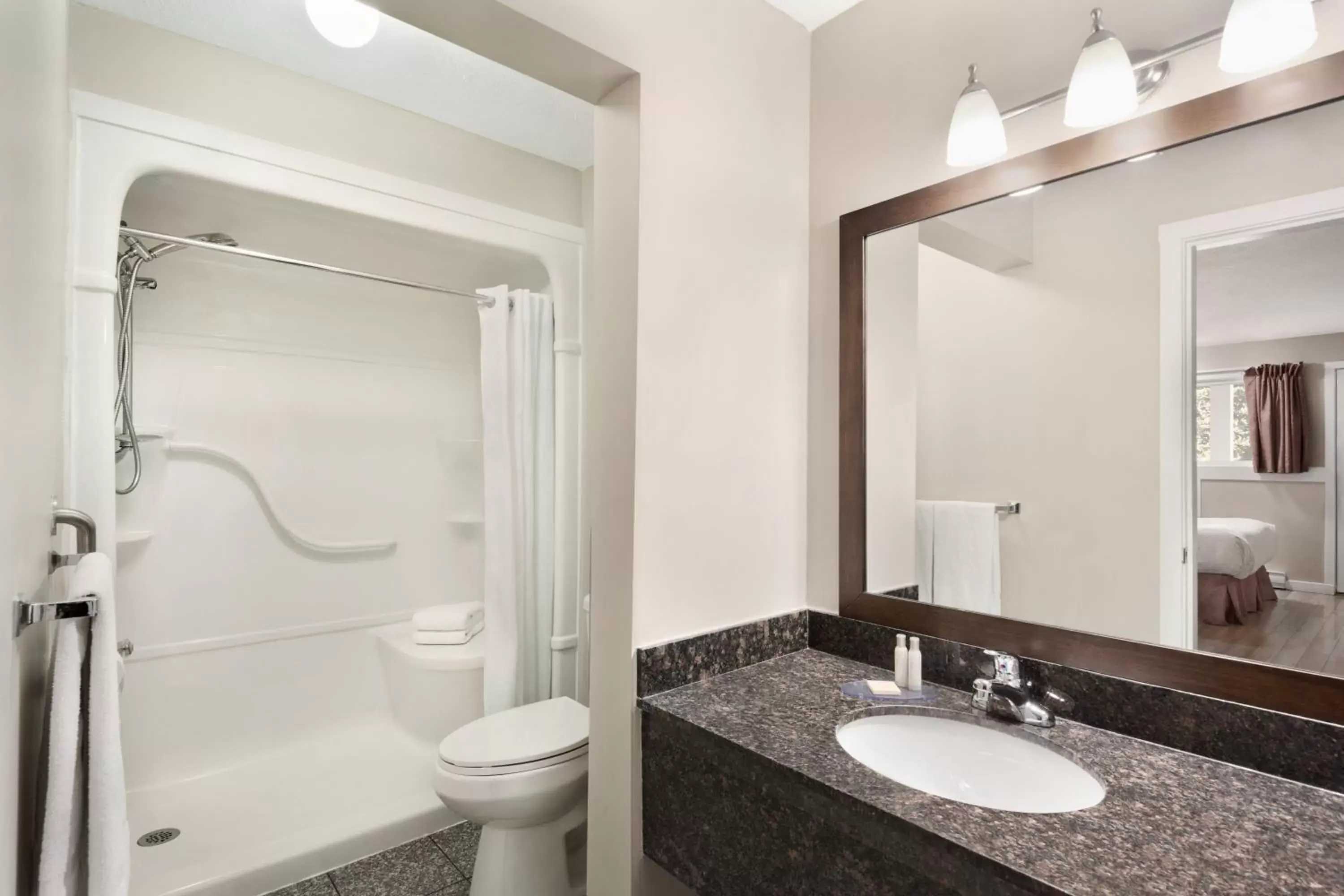 Toilet, Bathroom in Travelodge by Wyndham Salmon Arm BC