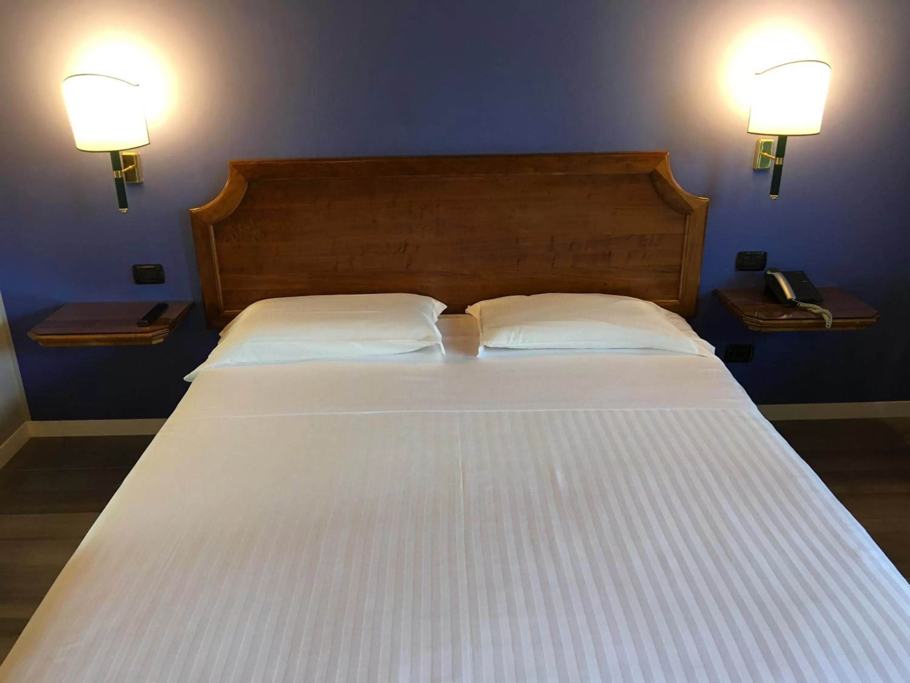 Bed in Hotel Don Carlo