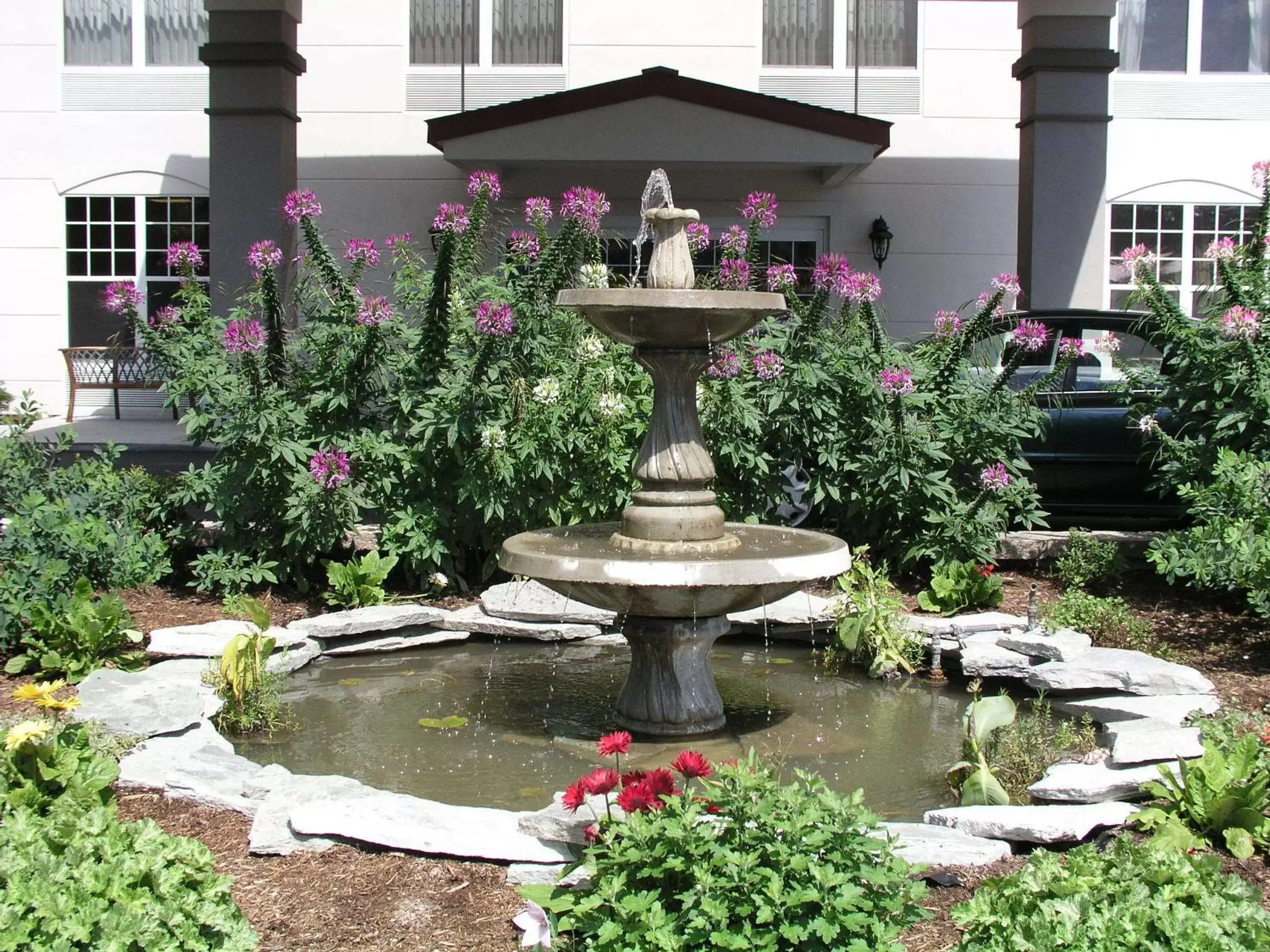 Facade/entrance, Garden in Fort William Henry Hotel