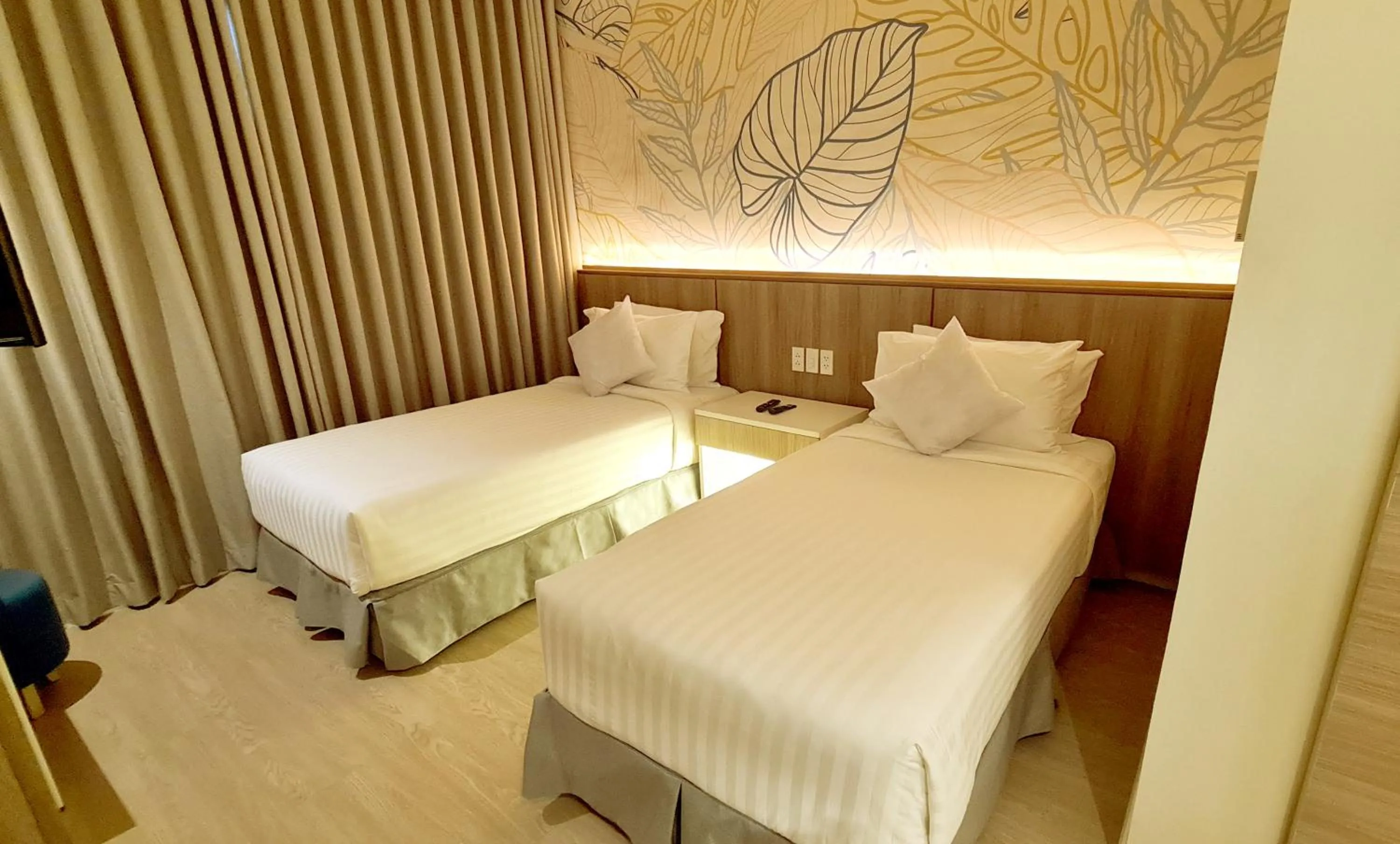 Bed in Harolds Hotel Quezon City