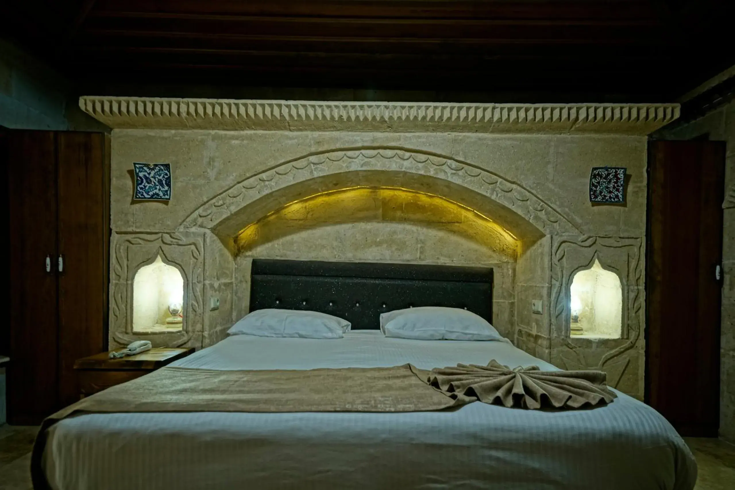 Bed in Holiday Cave Hotel