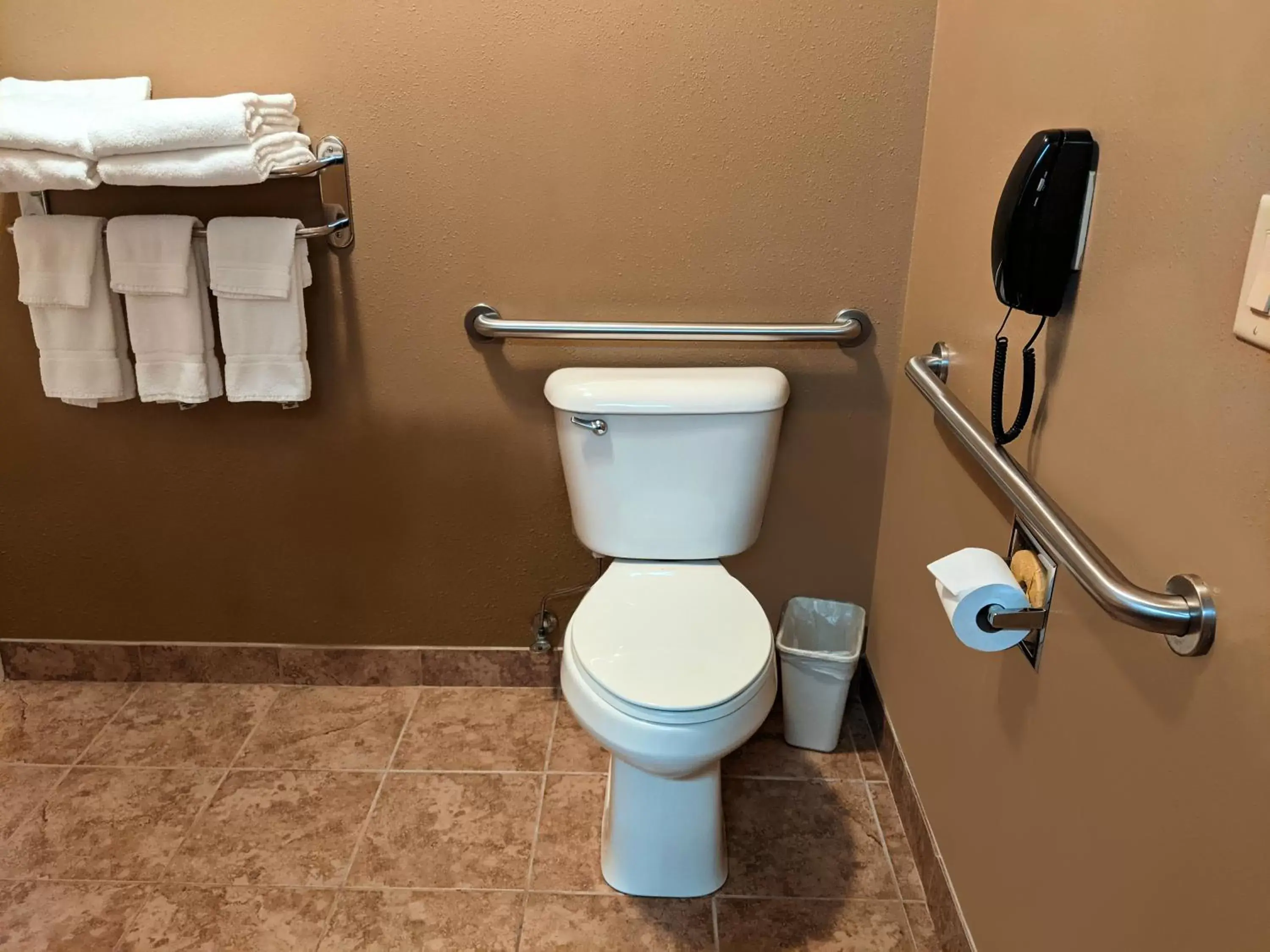 Toilet, Bathroom in Cobblestone Inn & Suites - Denison | Majestic Hills