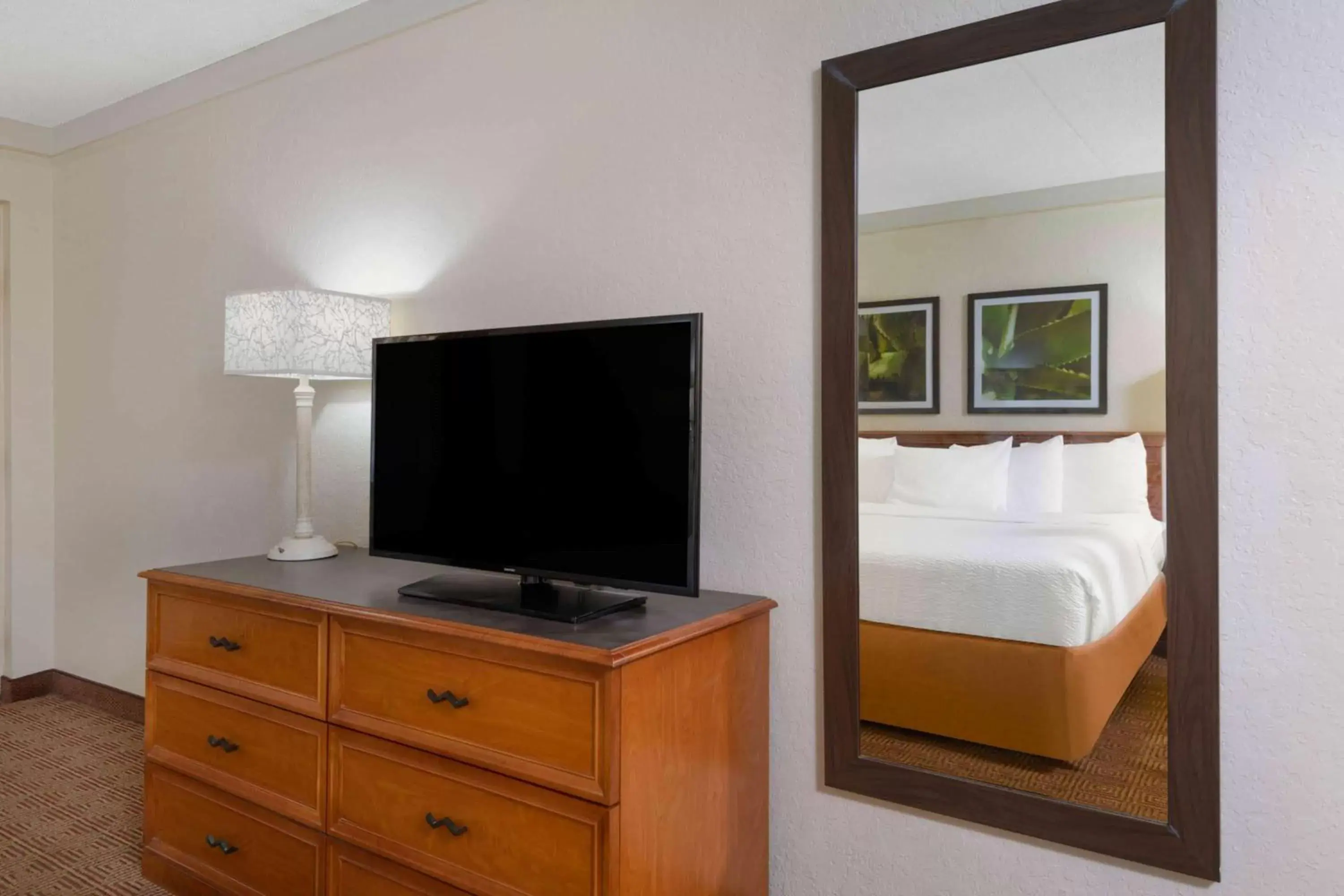 Photo of the whole room, TV/Entertainment Center in La Quinta Inn by Wyndham Deerfield Beach I-95 at Hillsboro E