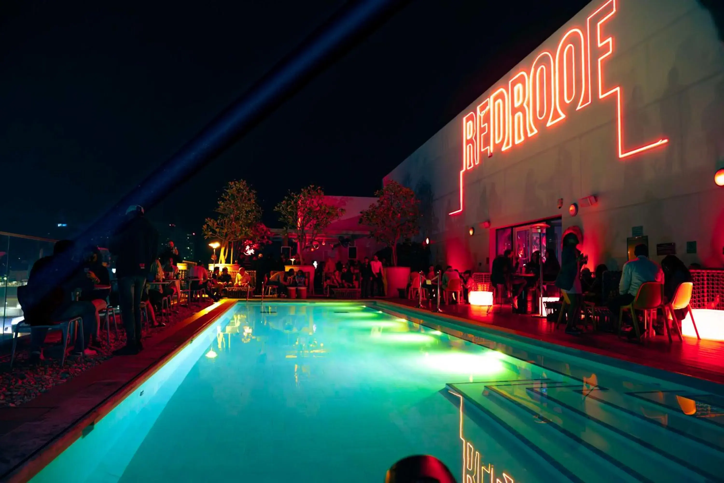 Lounge or bar, Swimming Pool in Radisson RED Dubai Silicon Oasis