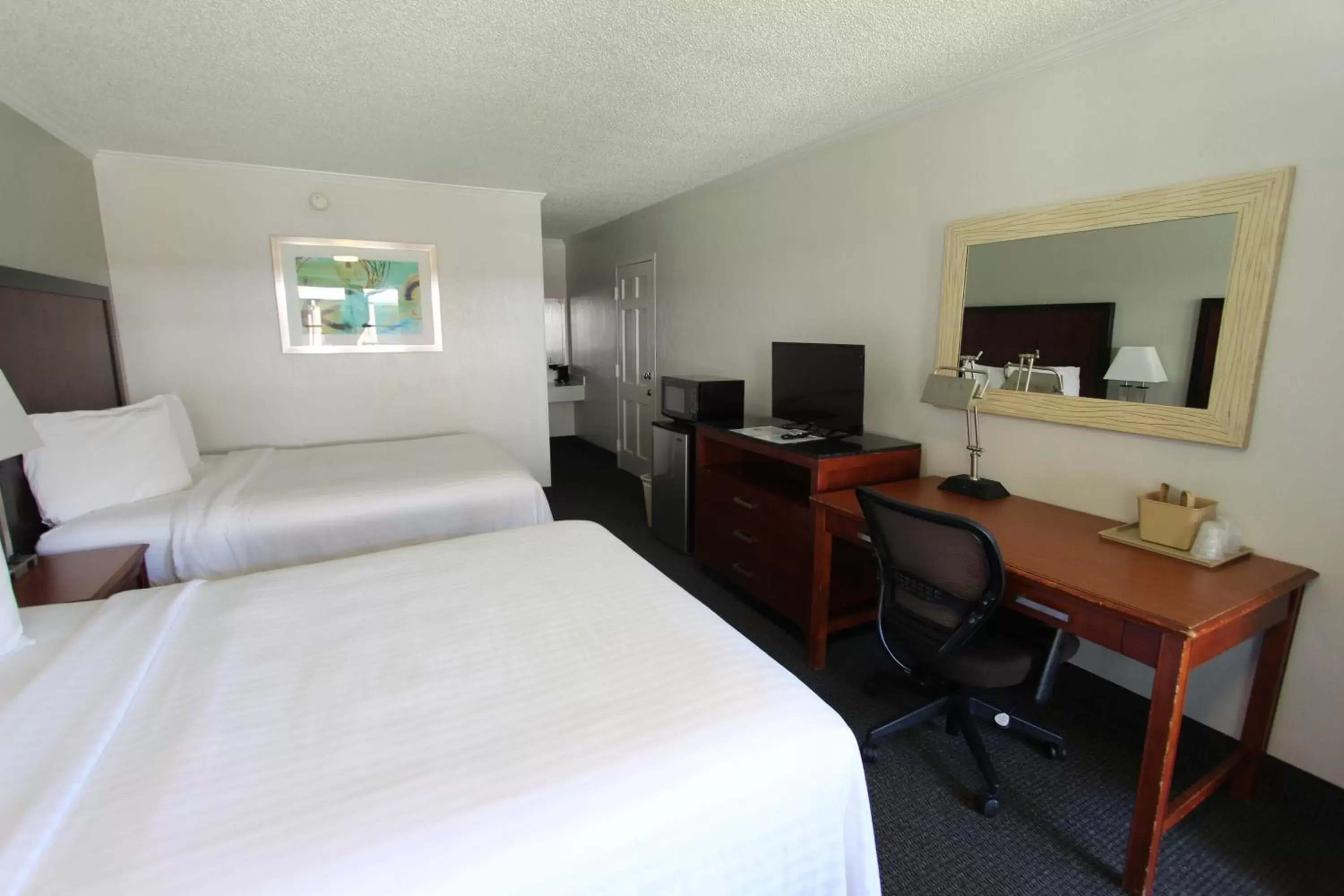 Bed in At Home Inn & Suites