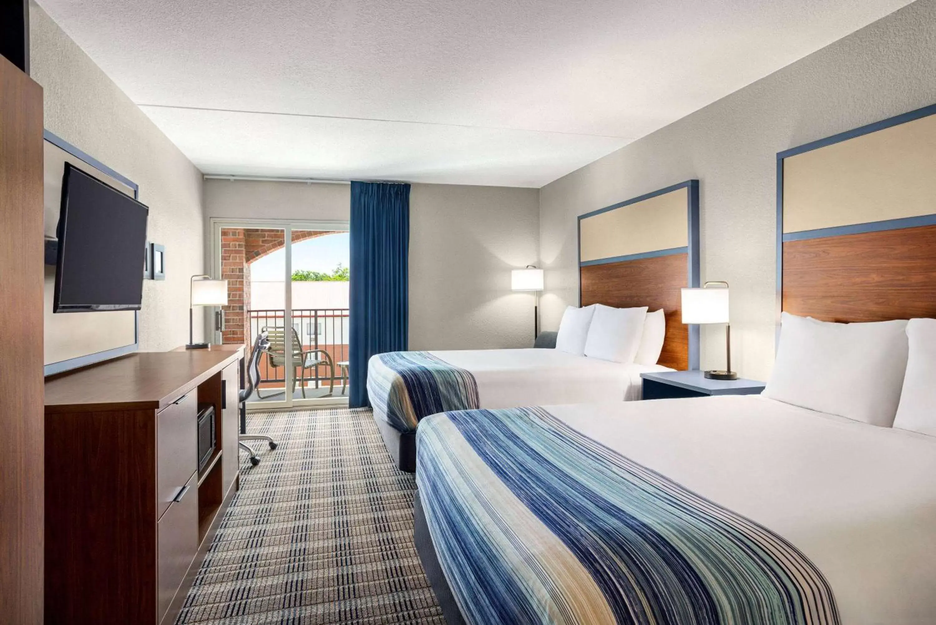 Photo of the whole room, Bed in AmericInn by Wyndham Branson & Conference Center