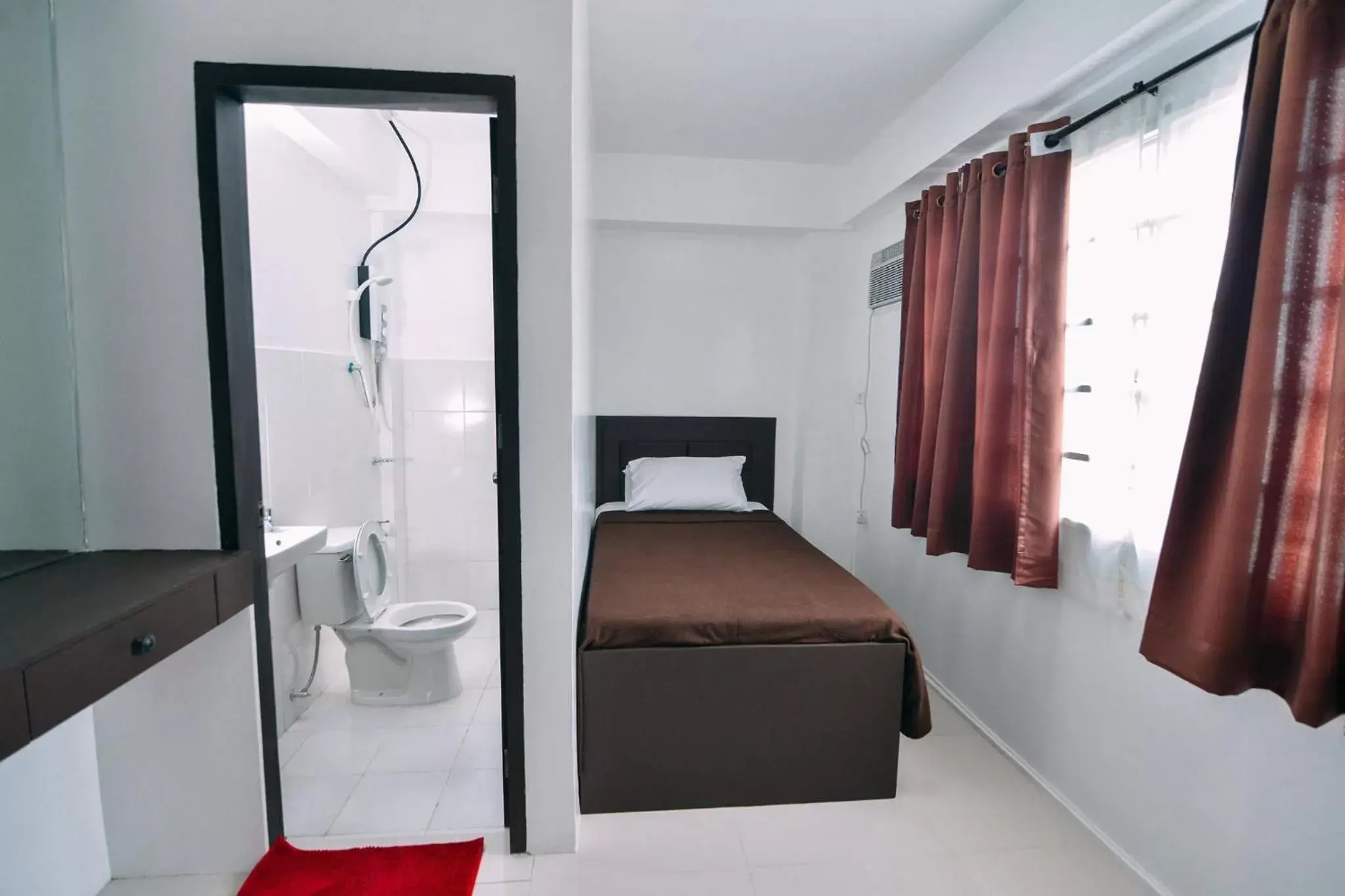 Bedroom, Bed in The Strand Suites and Dormitel Bedroom, Bed in The Strand Suites and Dormitel