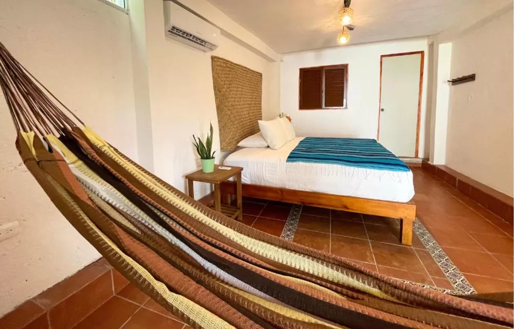 Bedroom, Bed in Hotel Villas Colibrí Suites & Bungalows
