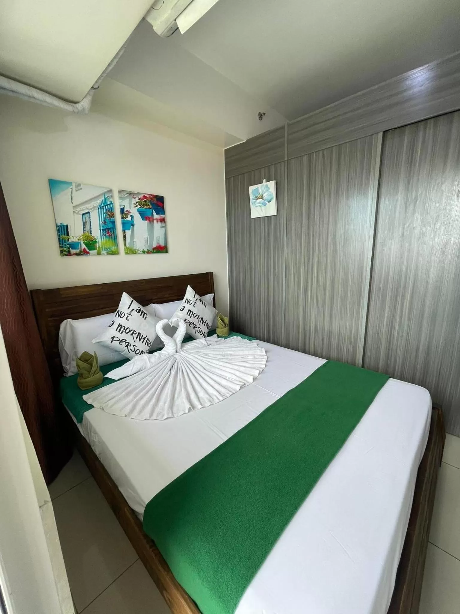 Bed in Green Residences Stays by PBYY