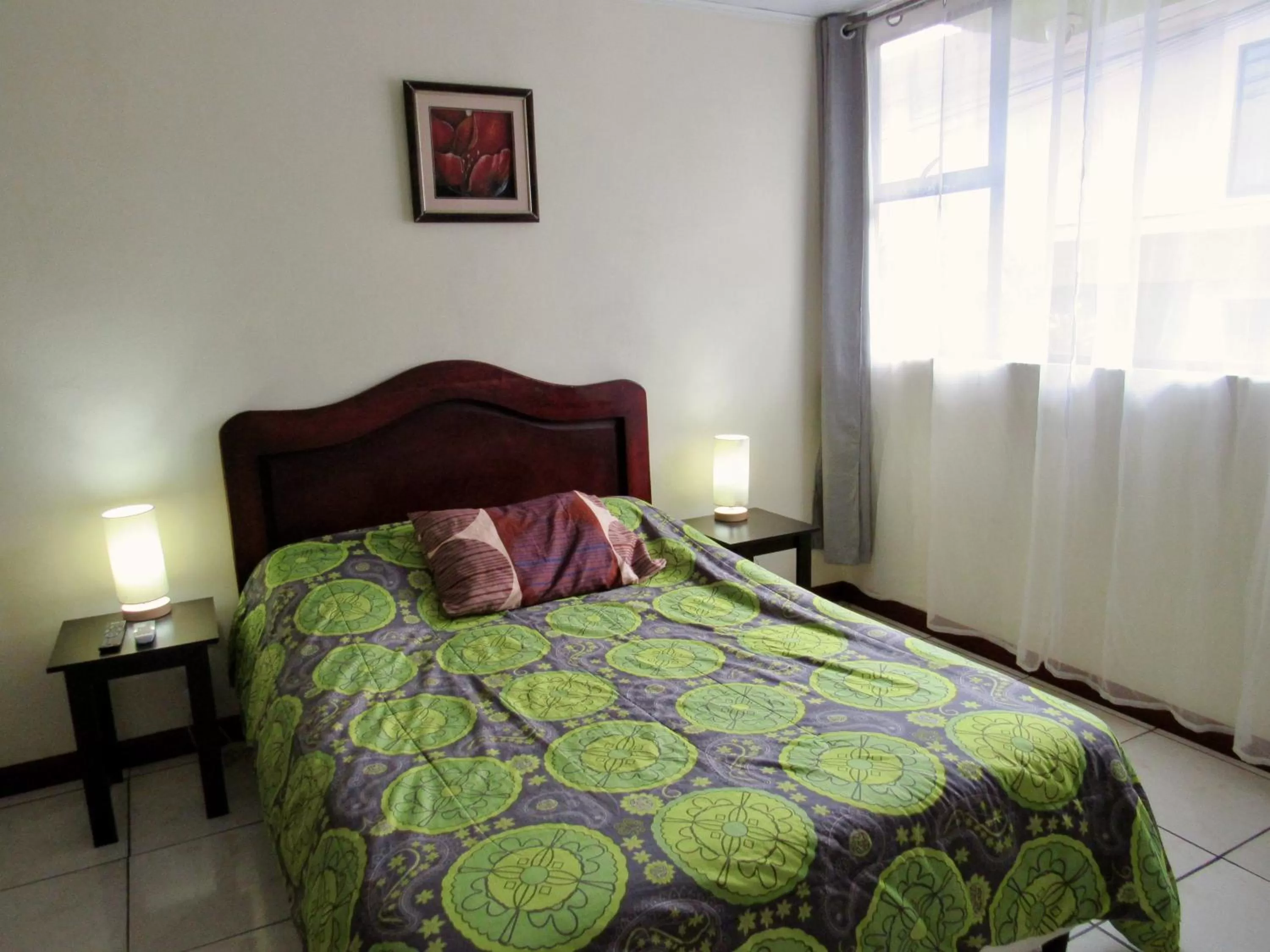 Bed in Hotel La Guaria Inn & Suites