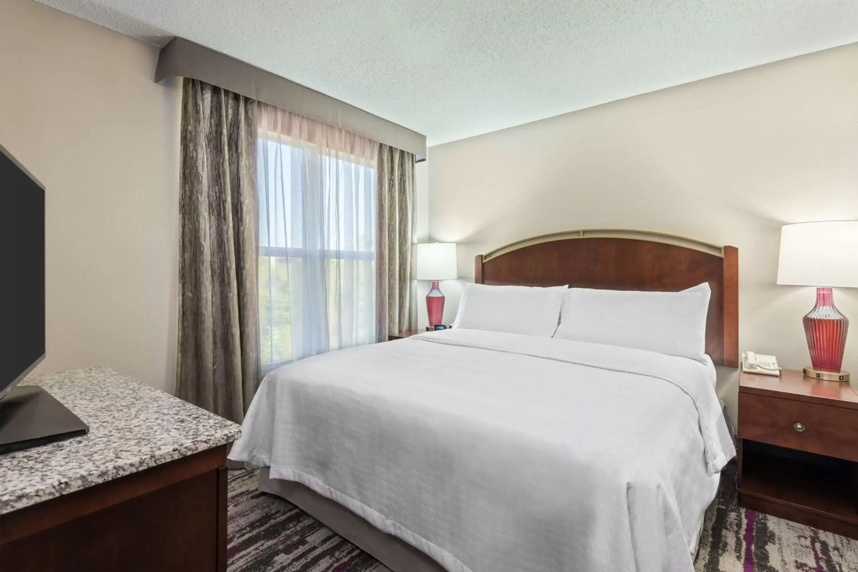 Bed in Homewood Suites by Hilton Orlando-UCF Area