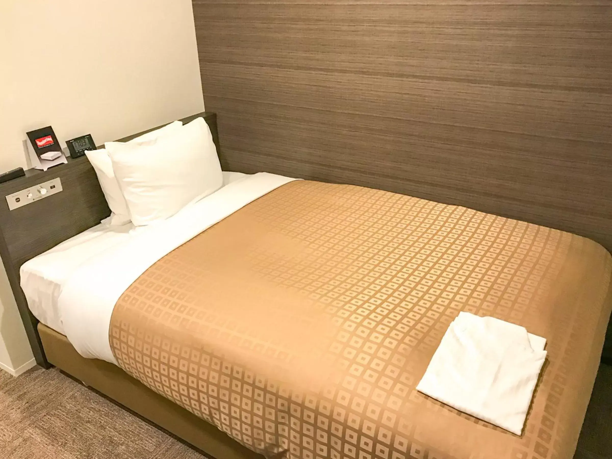 Bed in Hotel Livemax Toyama