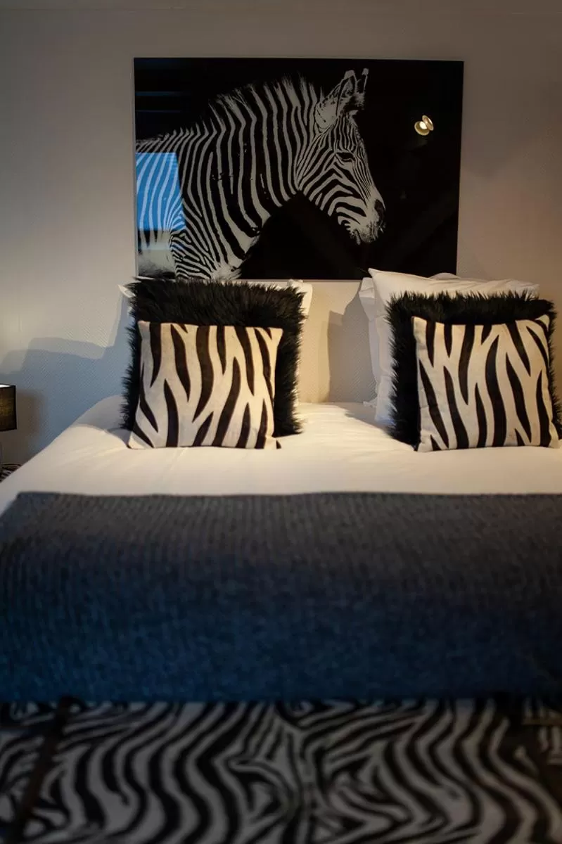 Bed in Bienvenue Chez Nous