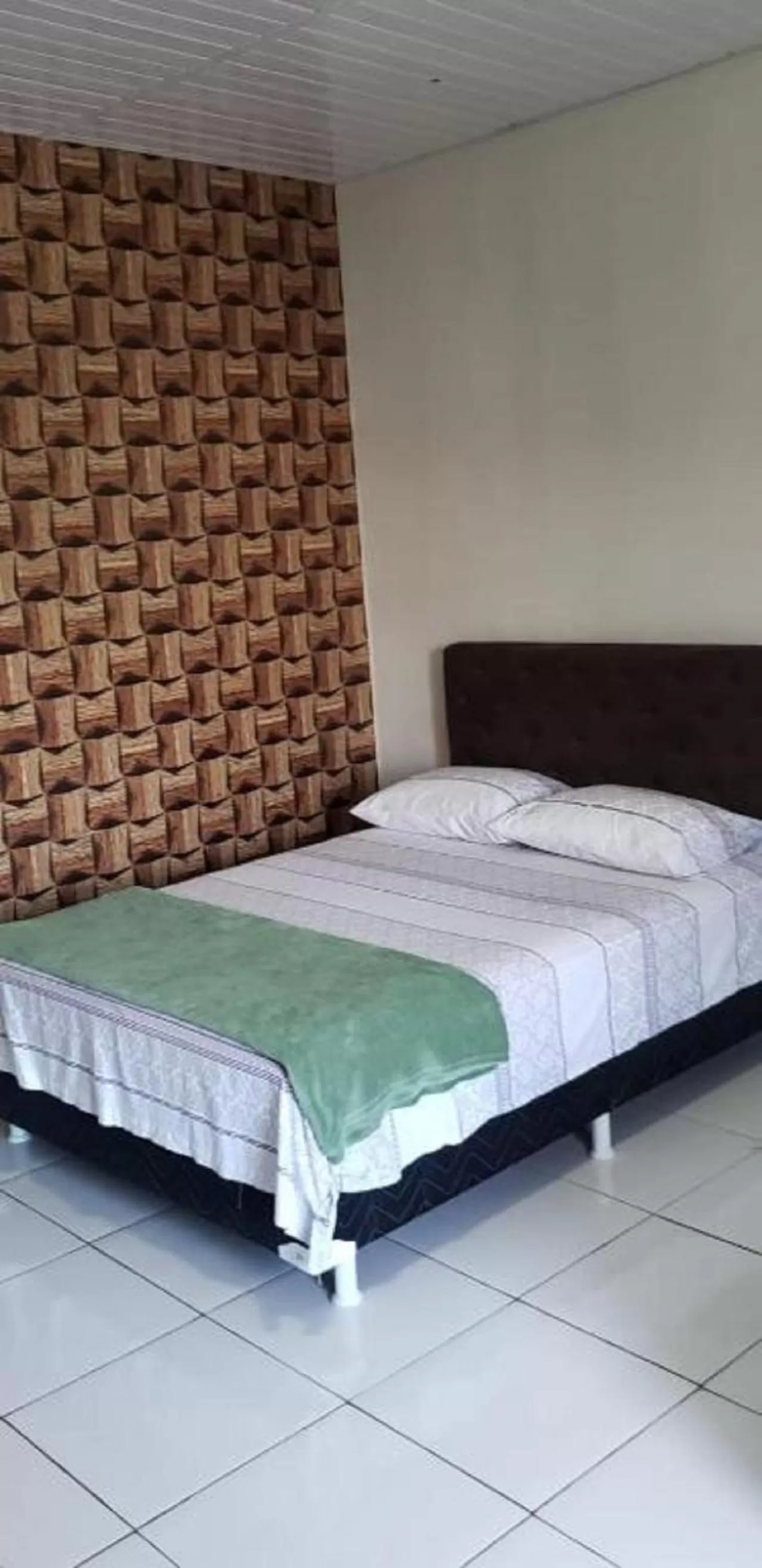 Bed in Pousada e Posto Amigão