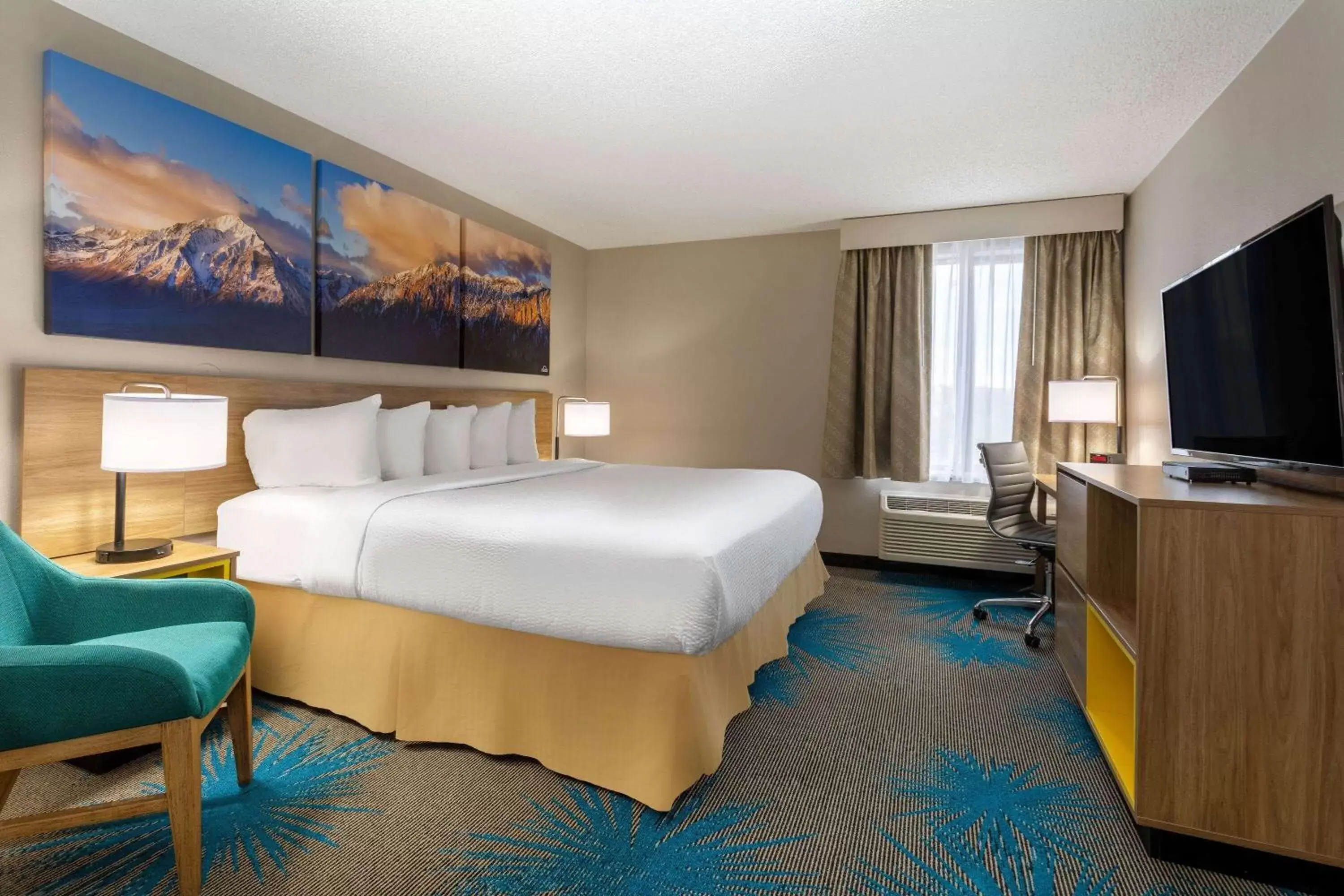 Photo of the whole room in Days Inn & Suites by Wyndham Denver International Airport