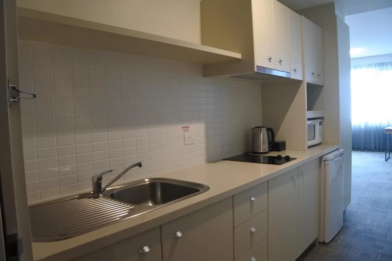 Kitchen or kitchenette in Bunbury Hotel Koombana Bay