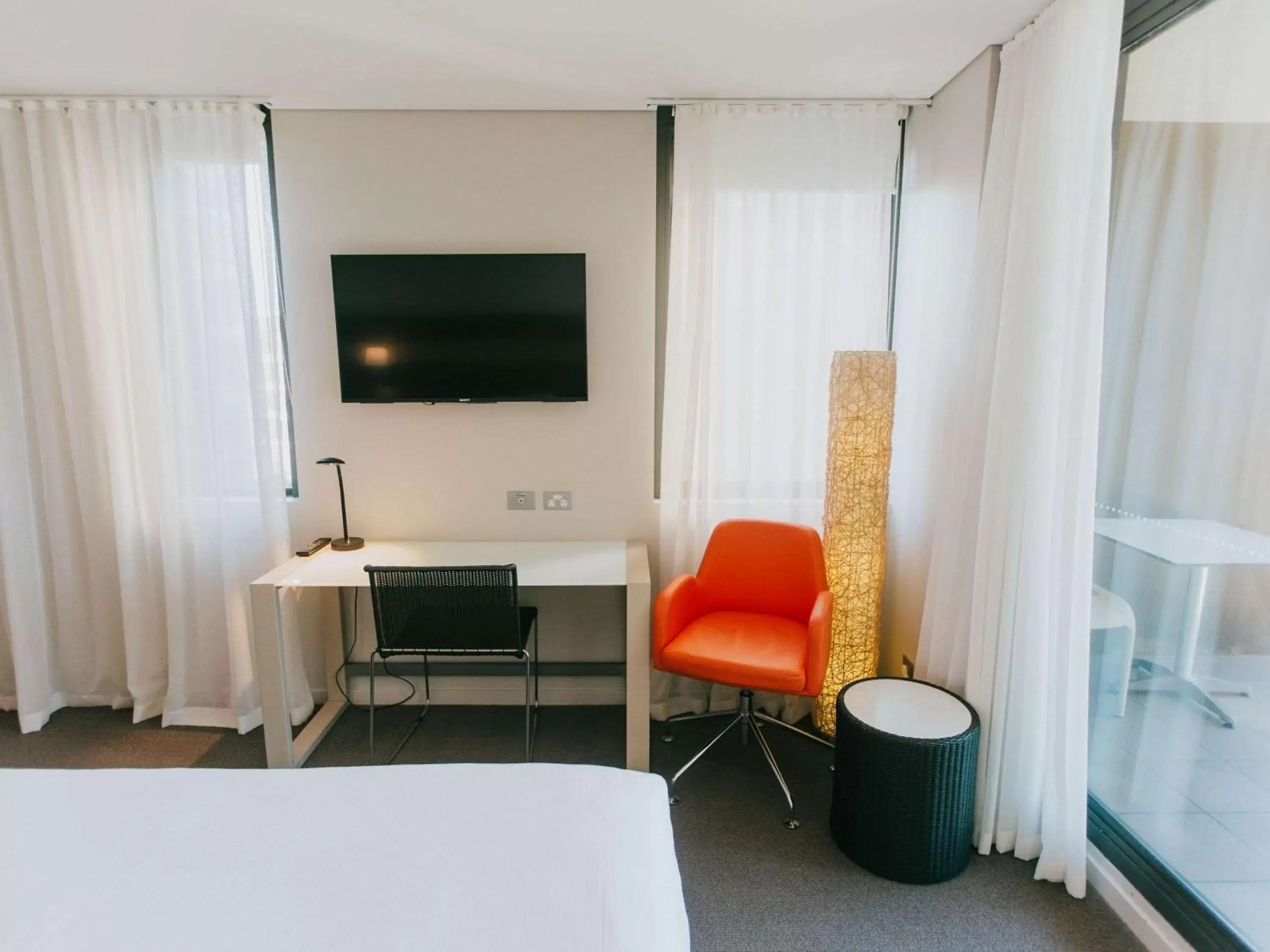 Photo of the whole room, TV/Entertainment Center in Novotel Newcastle Beach