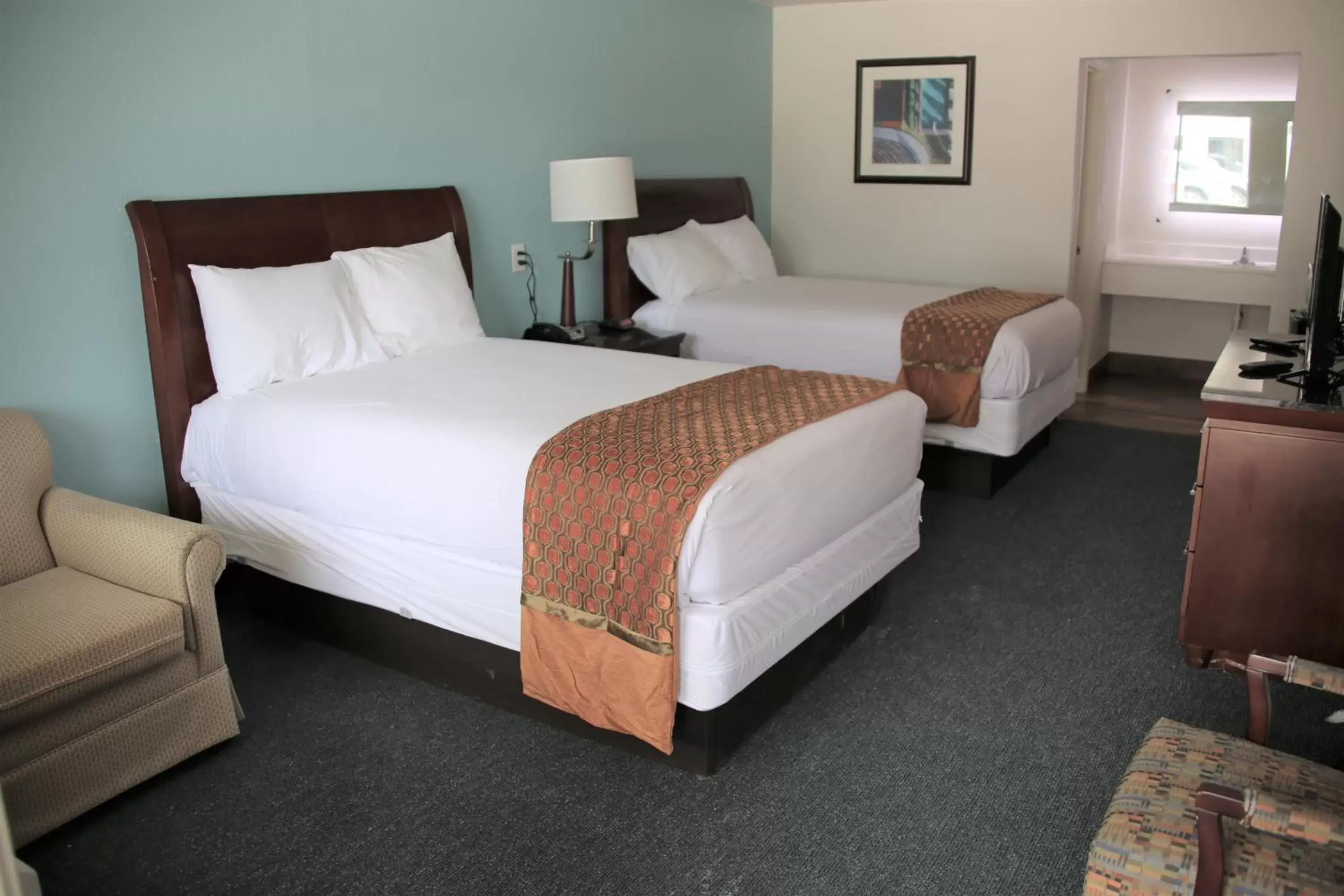 Bed in Executive Inn & Suites Cuero