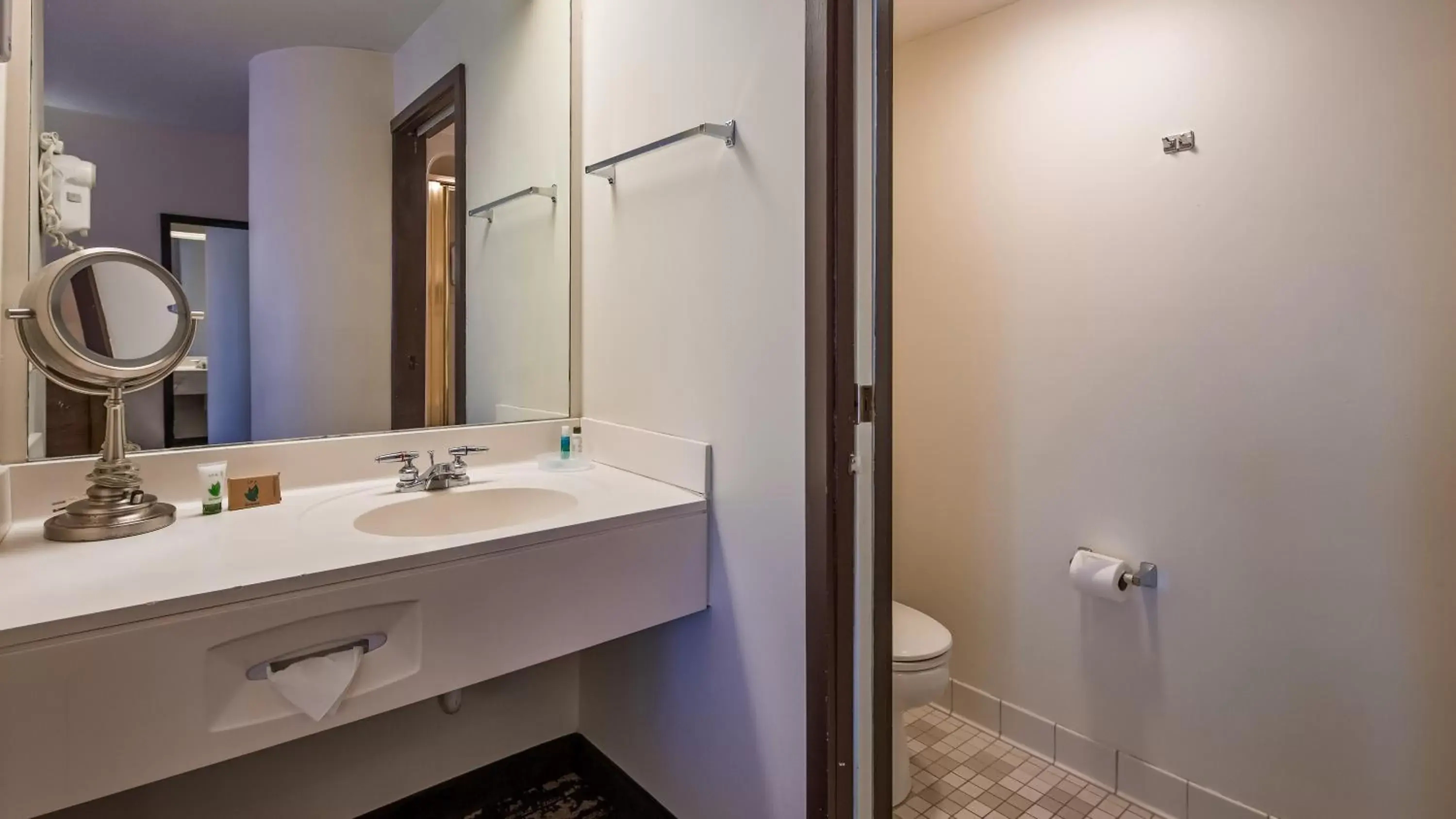 Bathroom in Charlevoix Inn & Suites SureStay Collection by Best Western