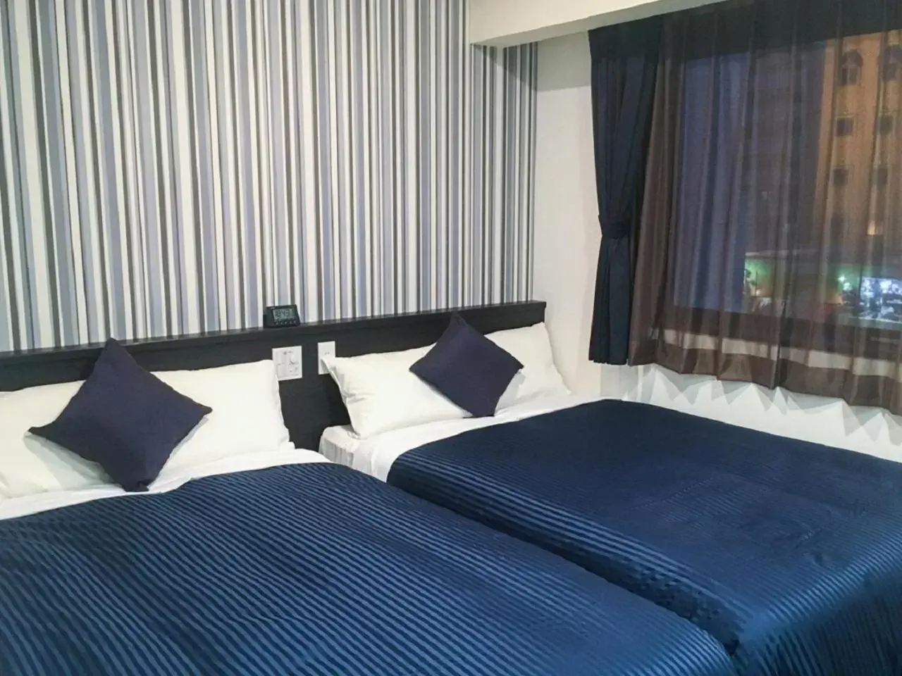 Bed in HOTEL LiVEMAX Yokkaichi Ekimae Bed in HOTEL LiVEMAX Yokkaichi Ekimae