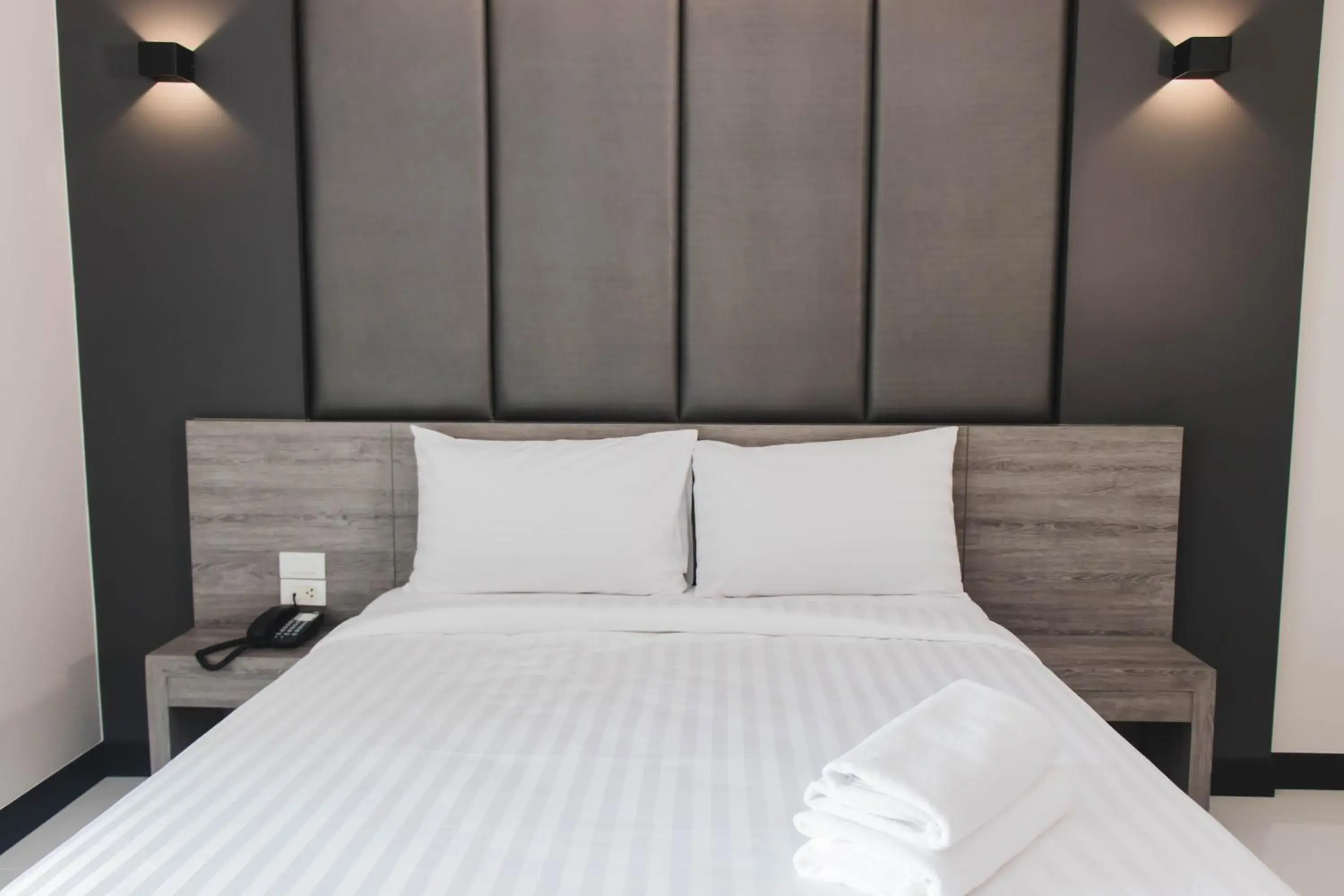 Bed in So good Hotel Bangkok
