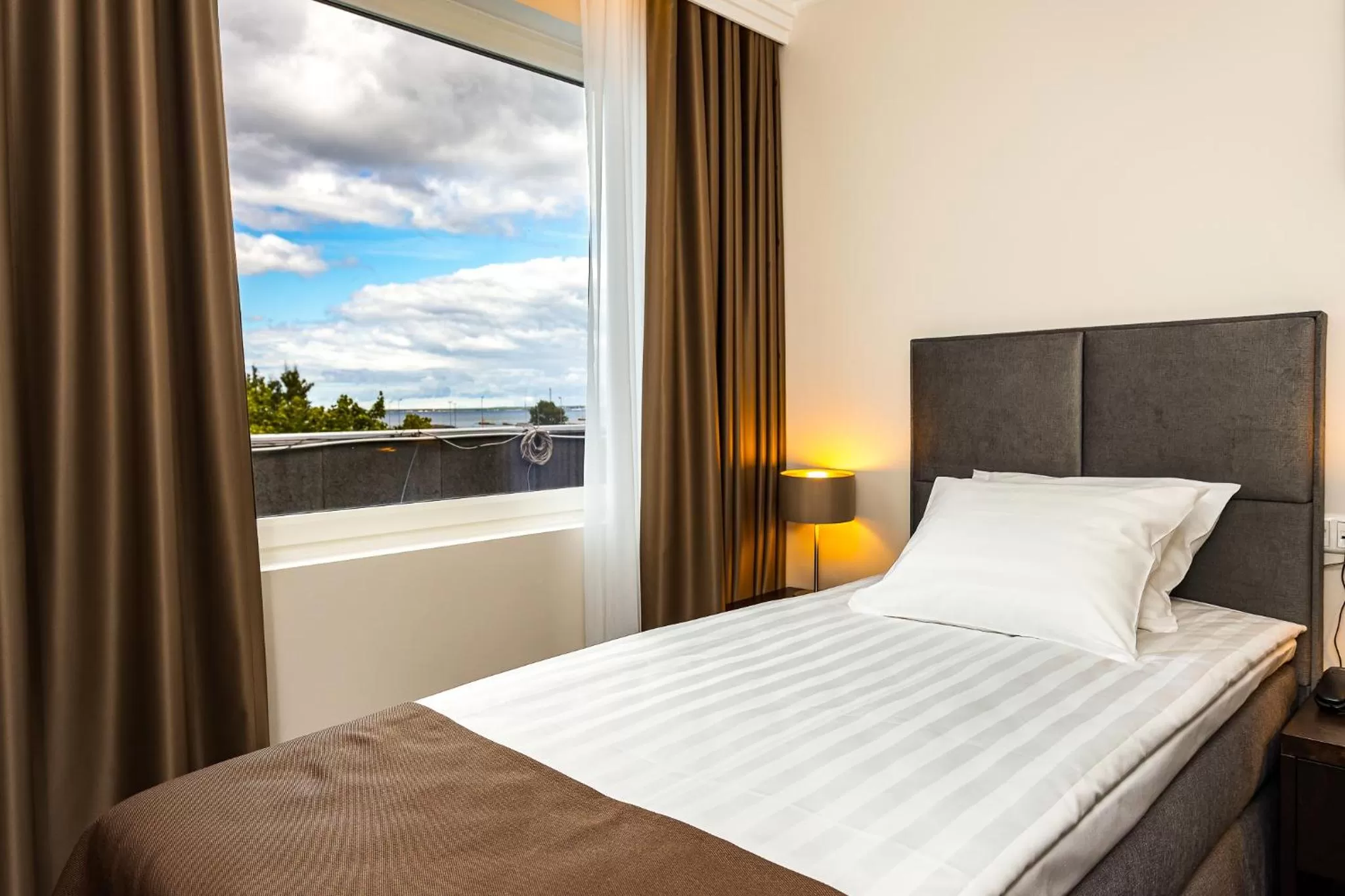 Bed in Adoryal Hotell