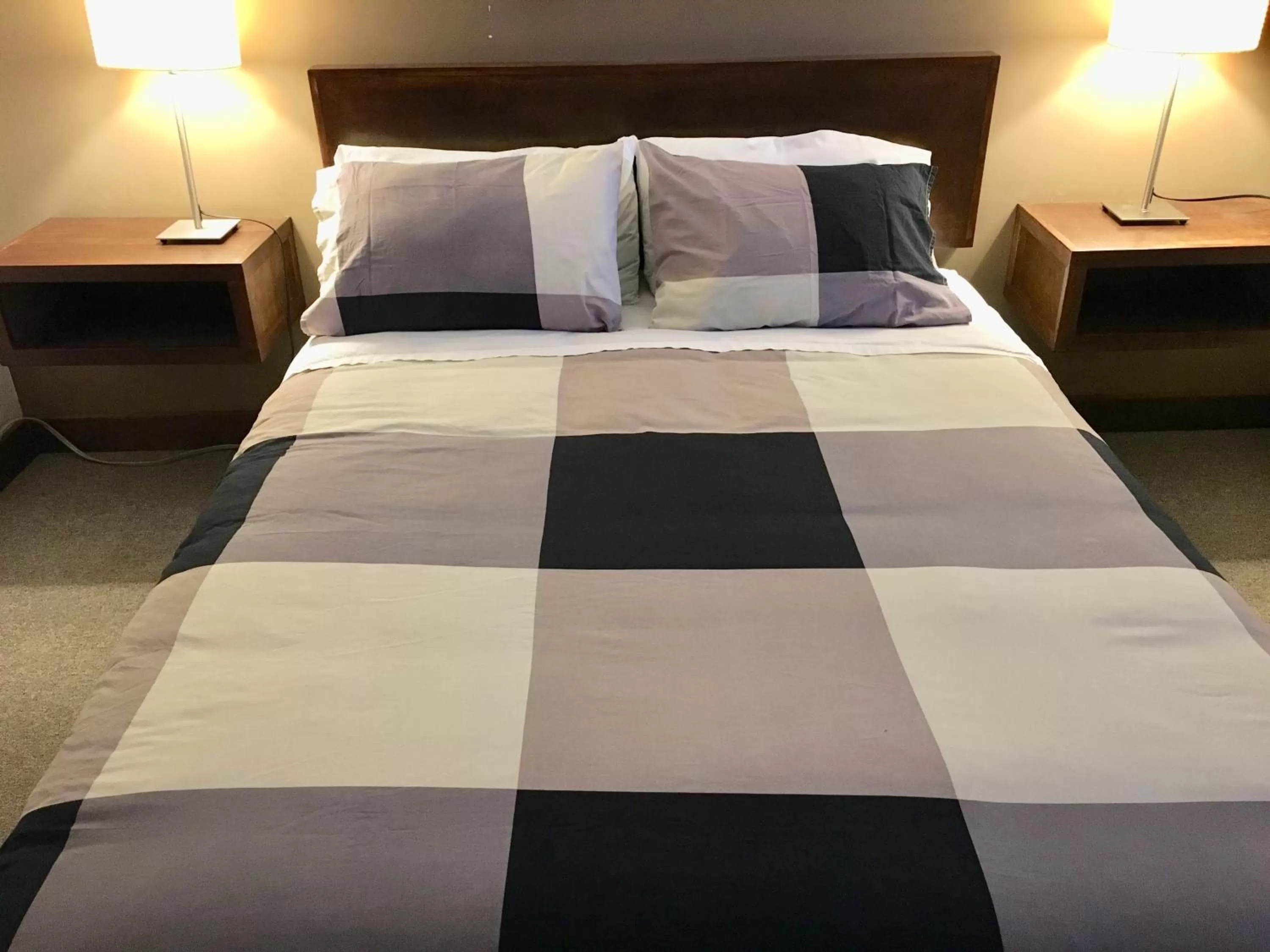 Bed in The Canterbury Inn of Downtown Invermere