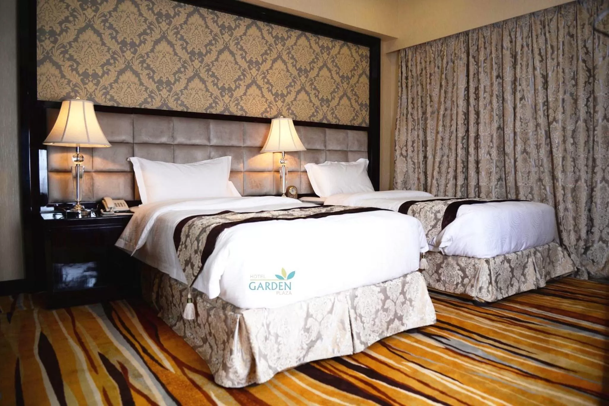 Bed in Garden Plaza Hotel