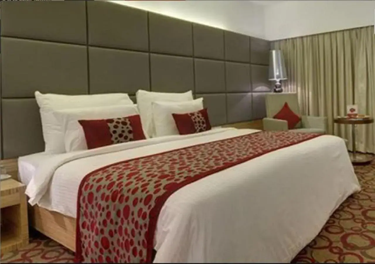 Bed in Pride Plaza Hotel, Ahmedabad