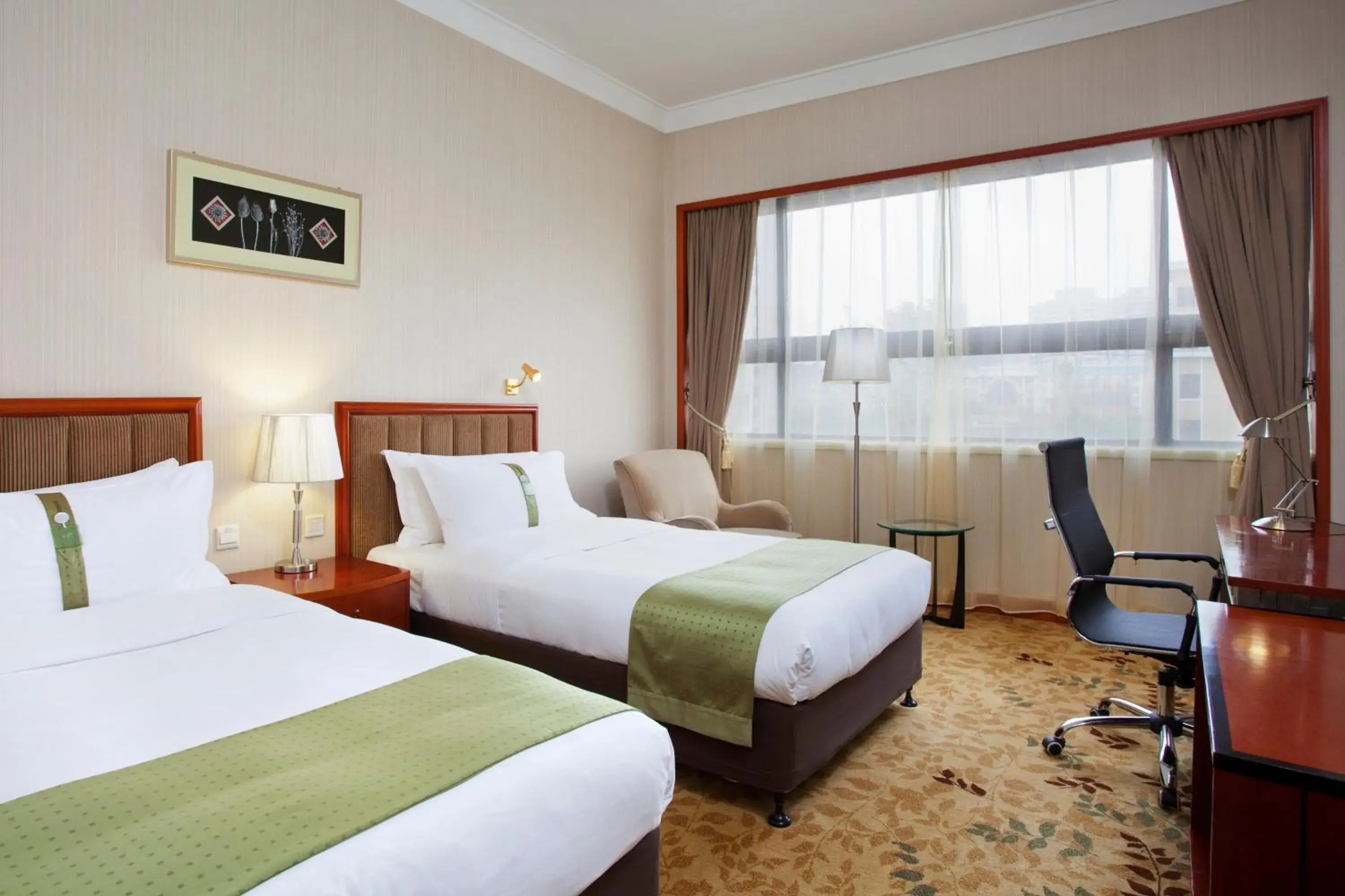Decorative detail, Bed in Holiday Inn Zhengzhou Zhongzhou, an IHG Hotel