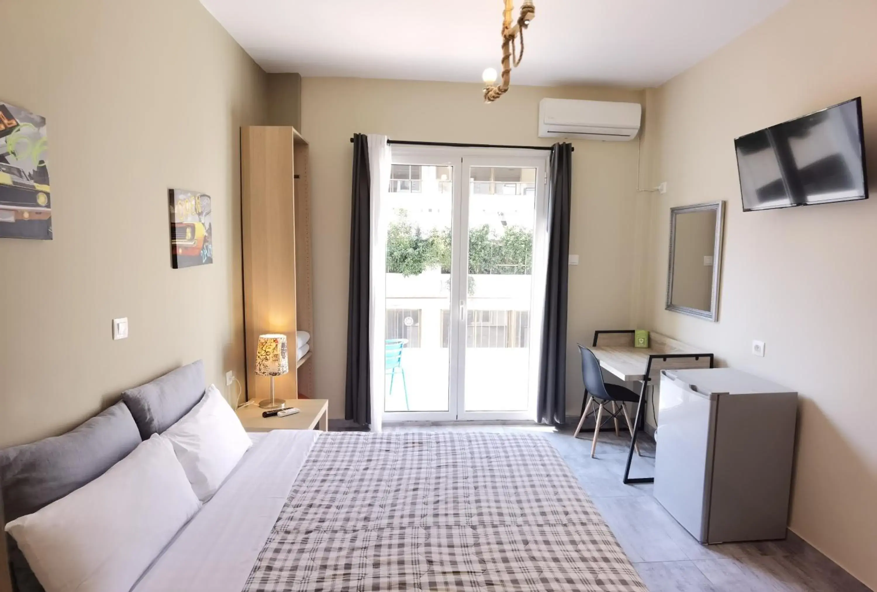 Bedroom, TV/Entertainment Center in Achillion Hotel Piraeus