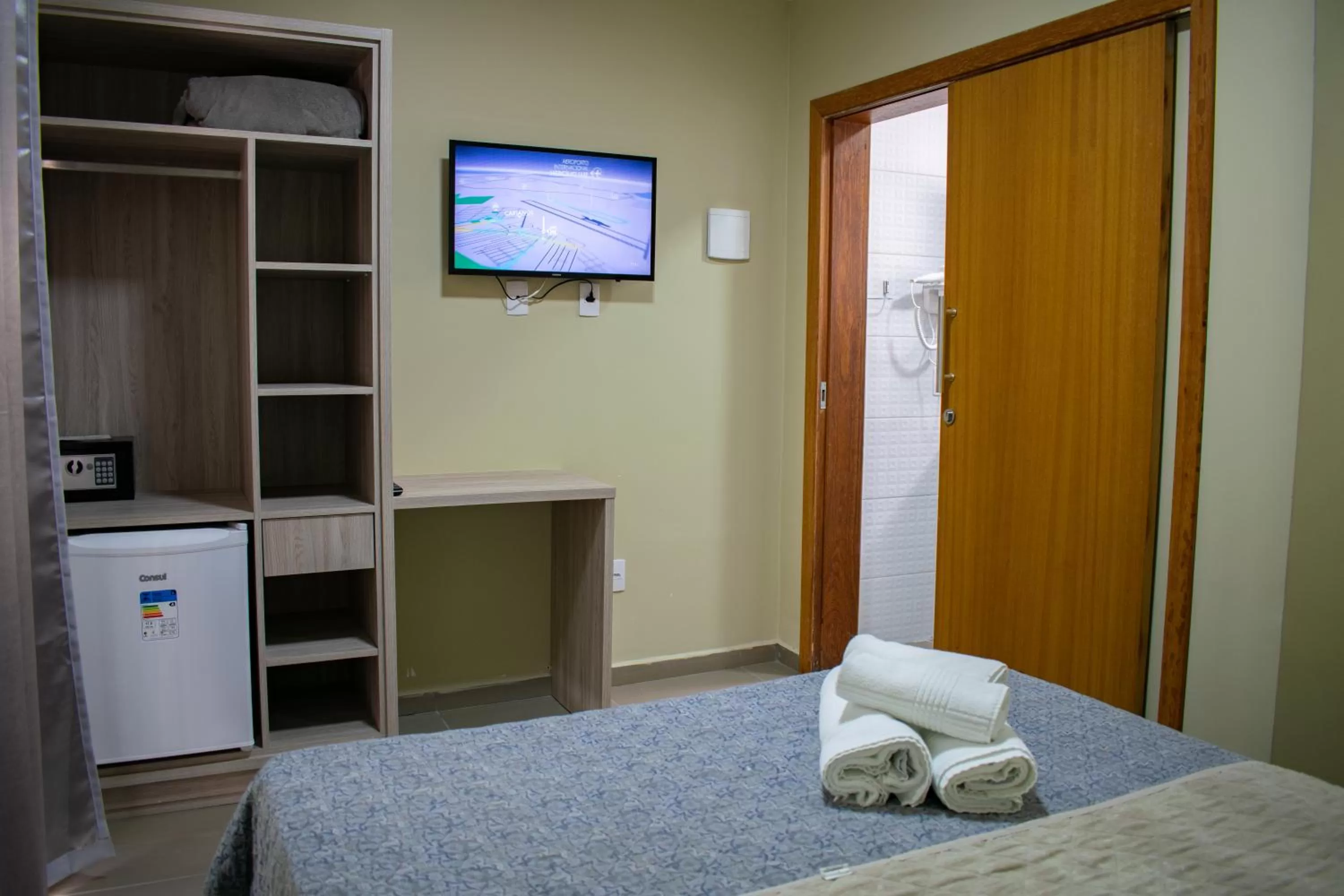 Bed in Pousada Tissiano