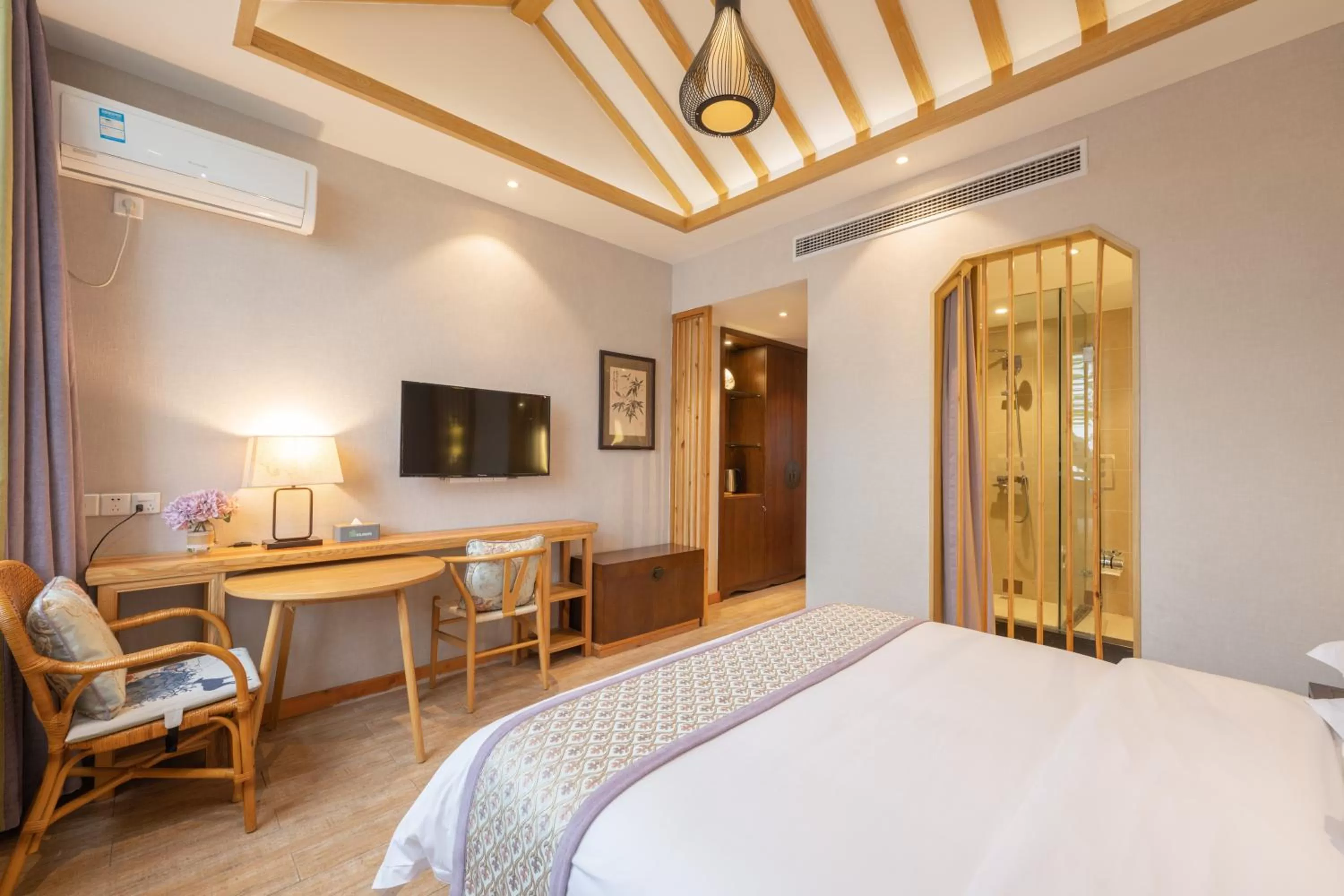 Photo of the whole room, TV/Entertainment Center in Mild Spring Boutique Hotel