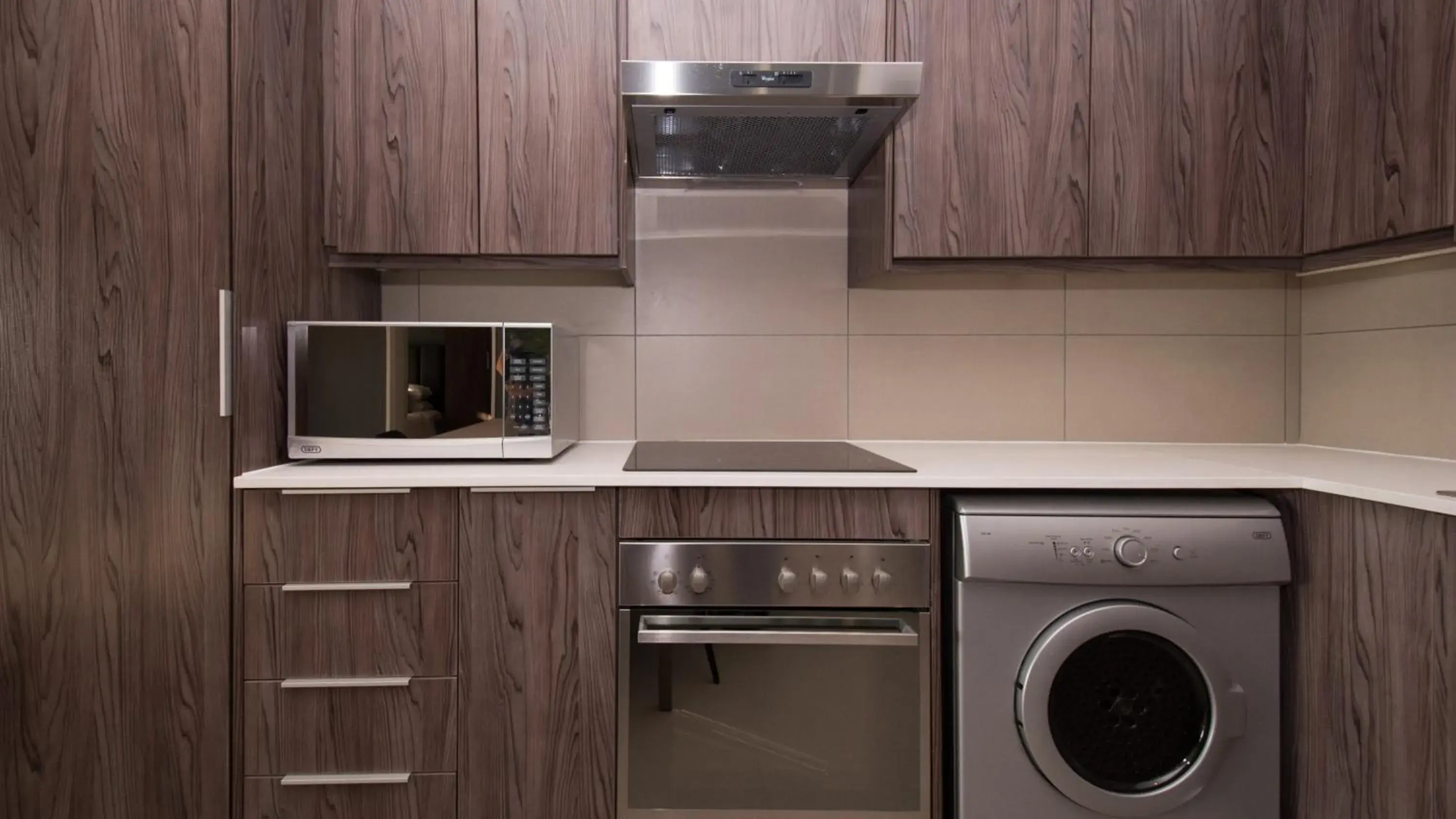 Kitchen or kitchenette in Odyssey Luxury Apartments - Back Up Generator Kitchen or kitchenette in Odyssey Luxury Apartments - Back Up Generator