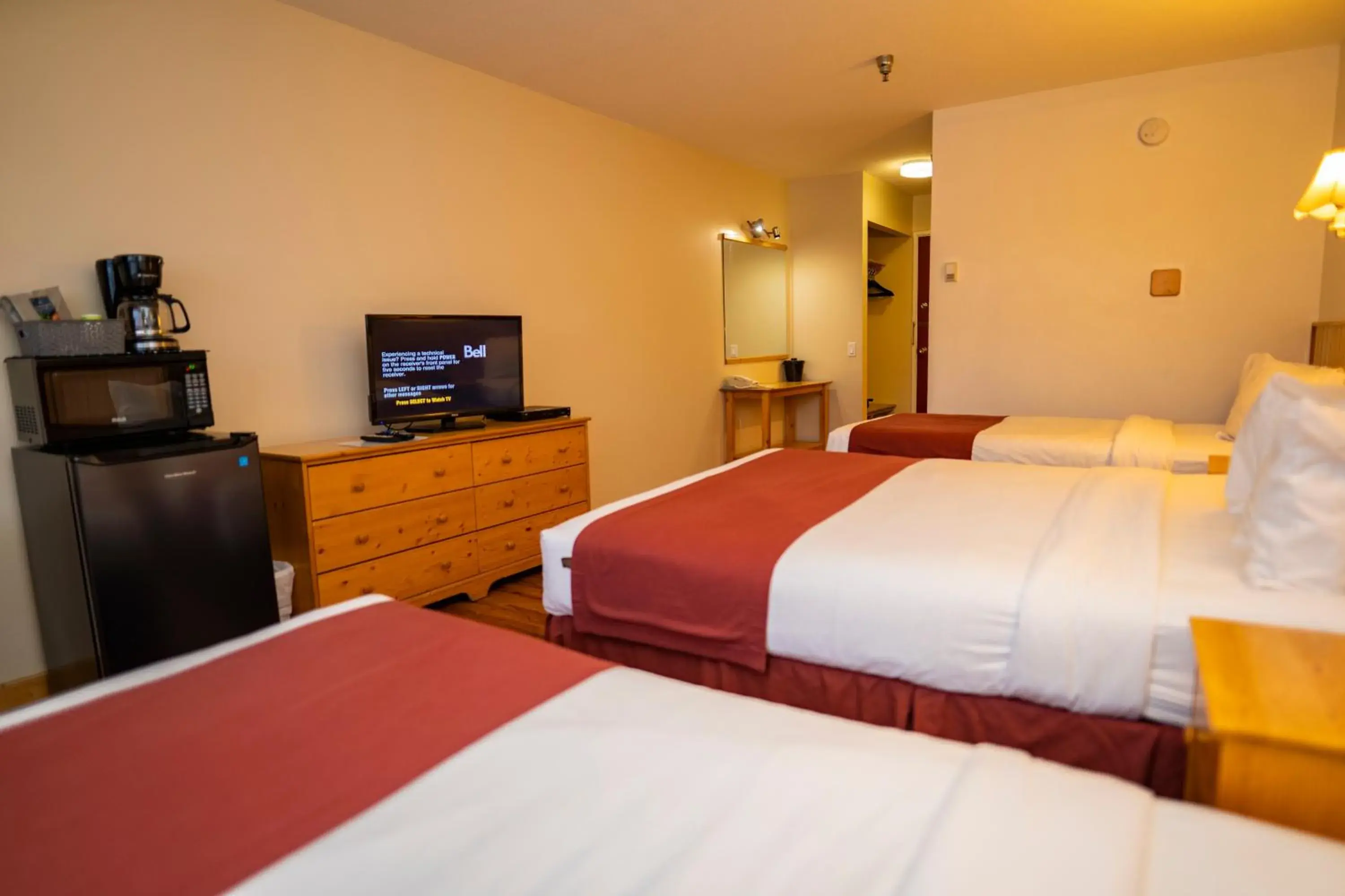 Bed in Canadas Best Value Inn- River View Hotel