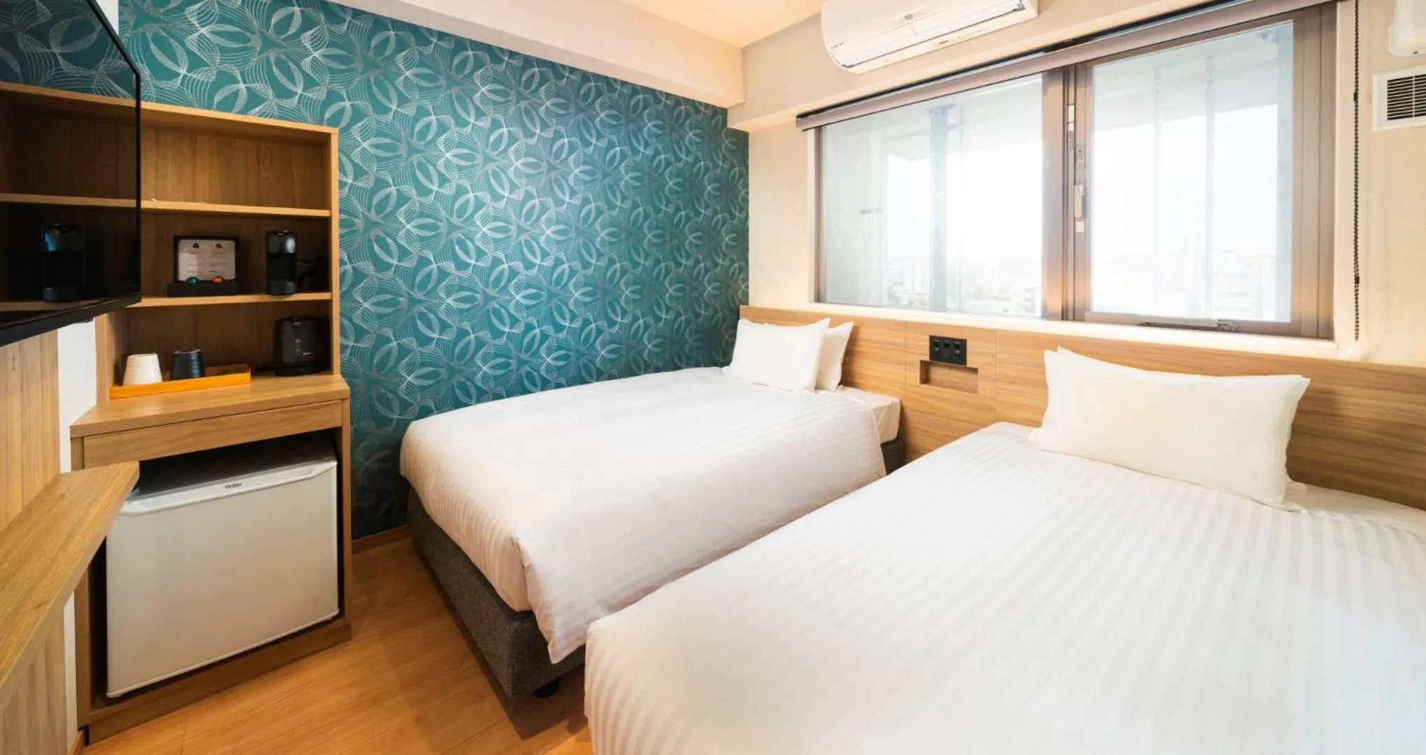 Bed in HOTEL SANSUI NAHA Ryukyu Onsen Naminoue-No-Yu