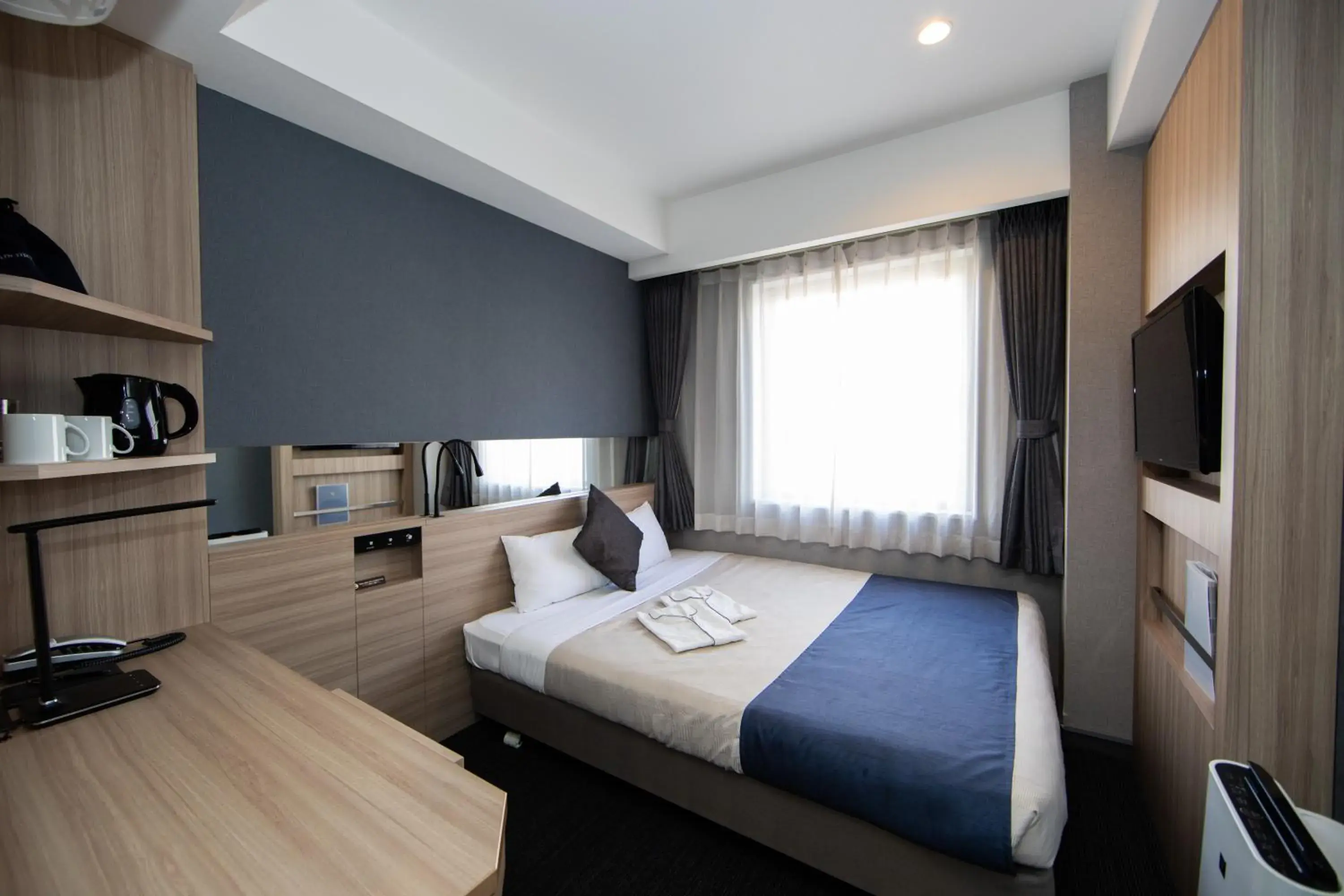 Photo of the whole room, Bed in Quintessa Hotel Osaka Shinsaibashi Comic & Books Photo of the whole room, Bed in Quintessa Hotel Osaka Shinsaibashi Comic & Books