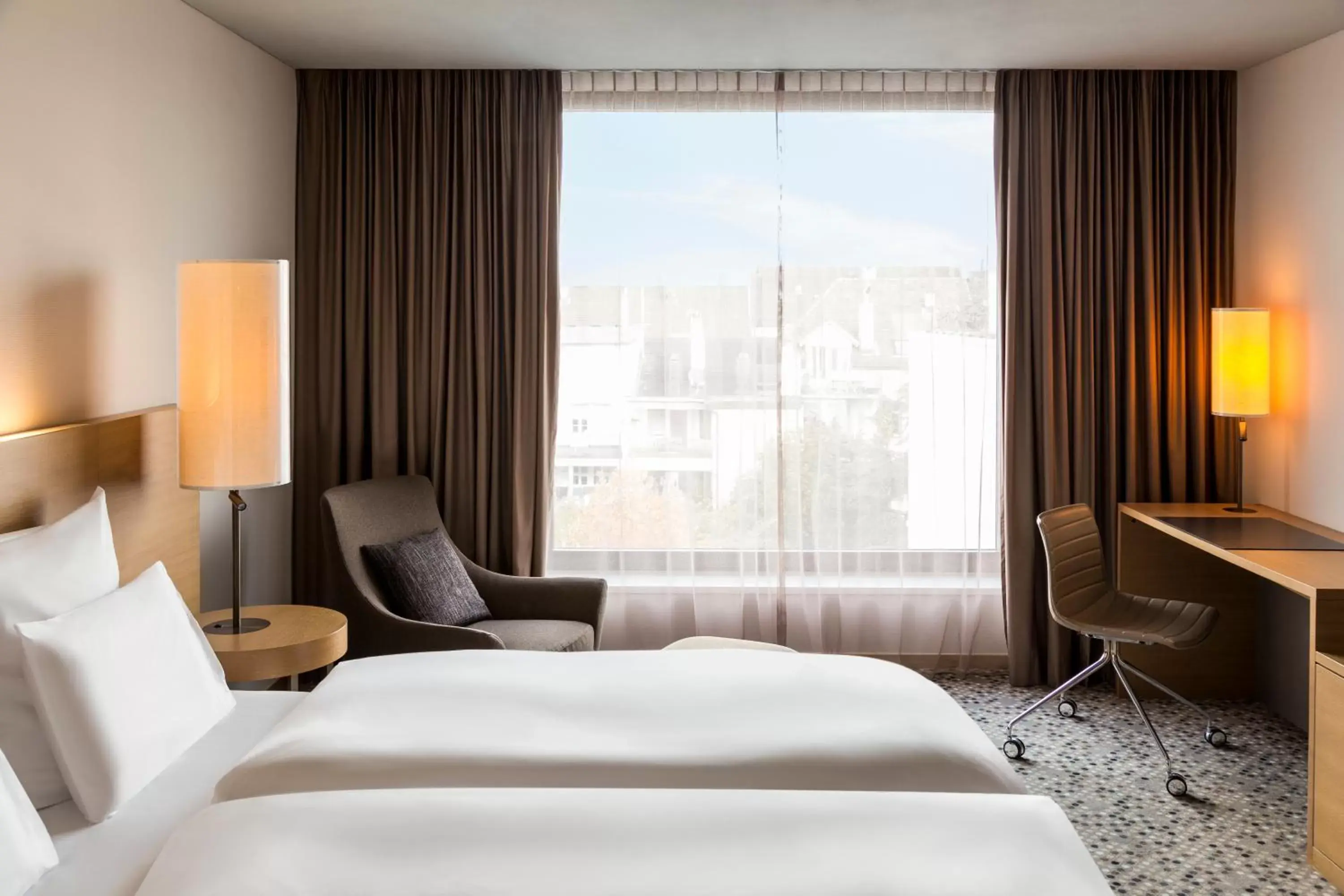 Photo of the whole room, Bed in Pullman Basel Europe