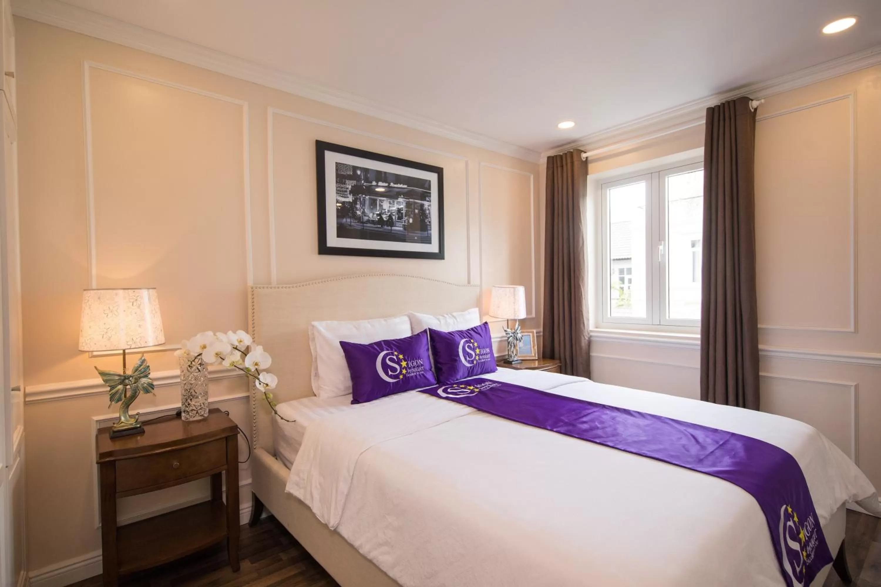 Bed in Saigon By Night Luxury Hotel