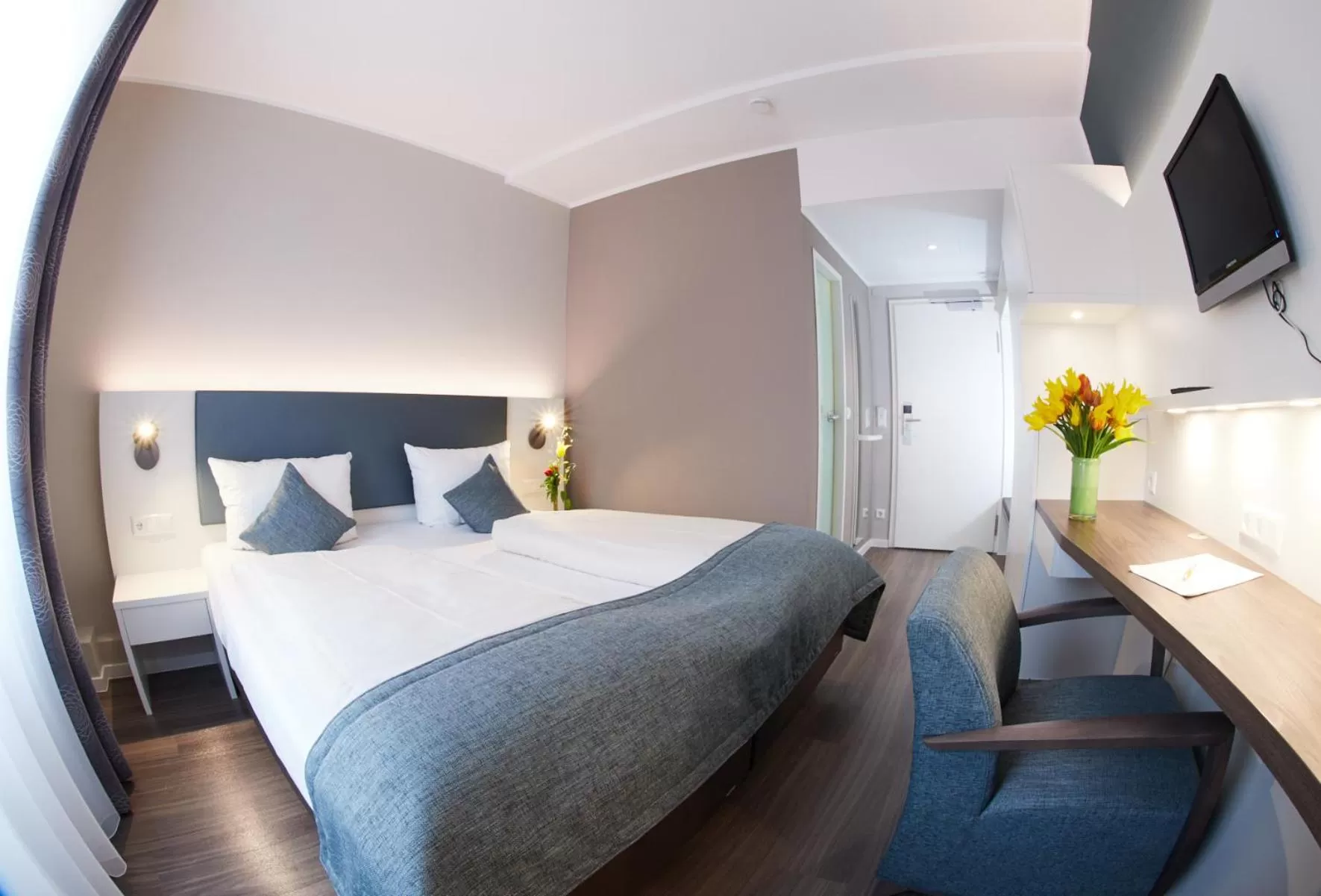 Photo of the whole room, Bed in Stadthotel Freiburg Kolping Hotels & Resorts