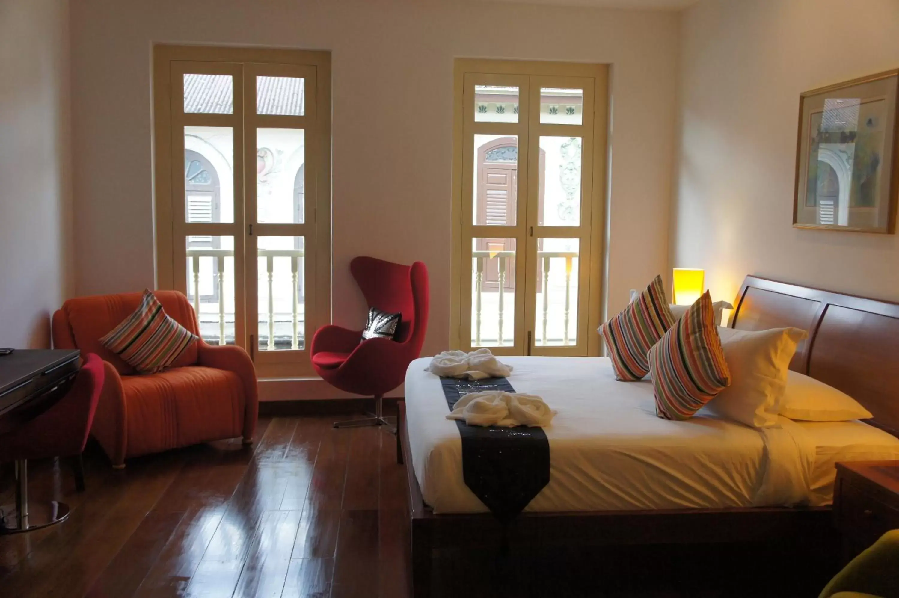 Bed in Heeren Palm Suites Bed in Heeren Palm Suites