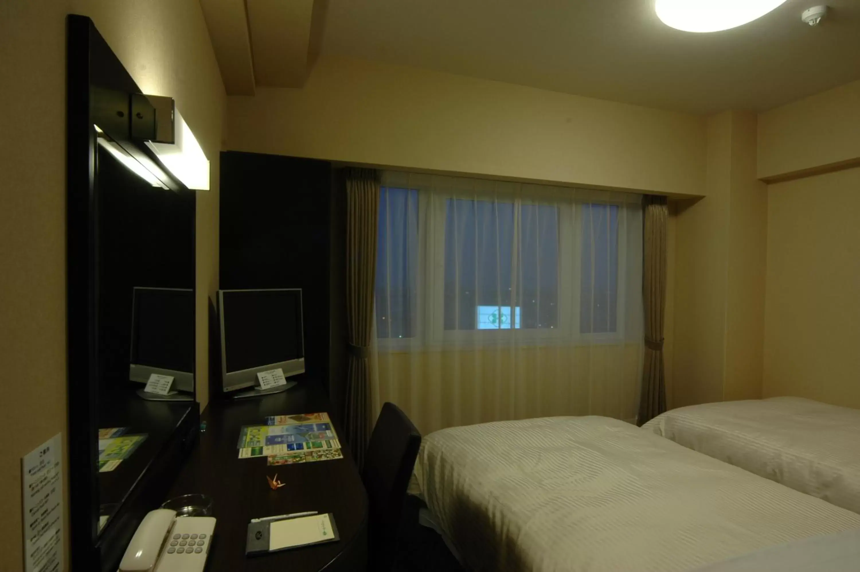 Photo of the whole room, Bed in Hotel Route-Inn Kushiro Ekimae