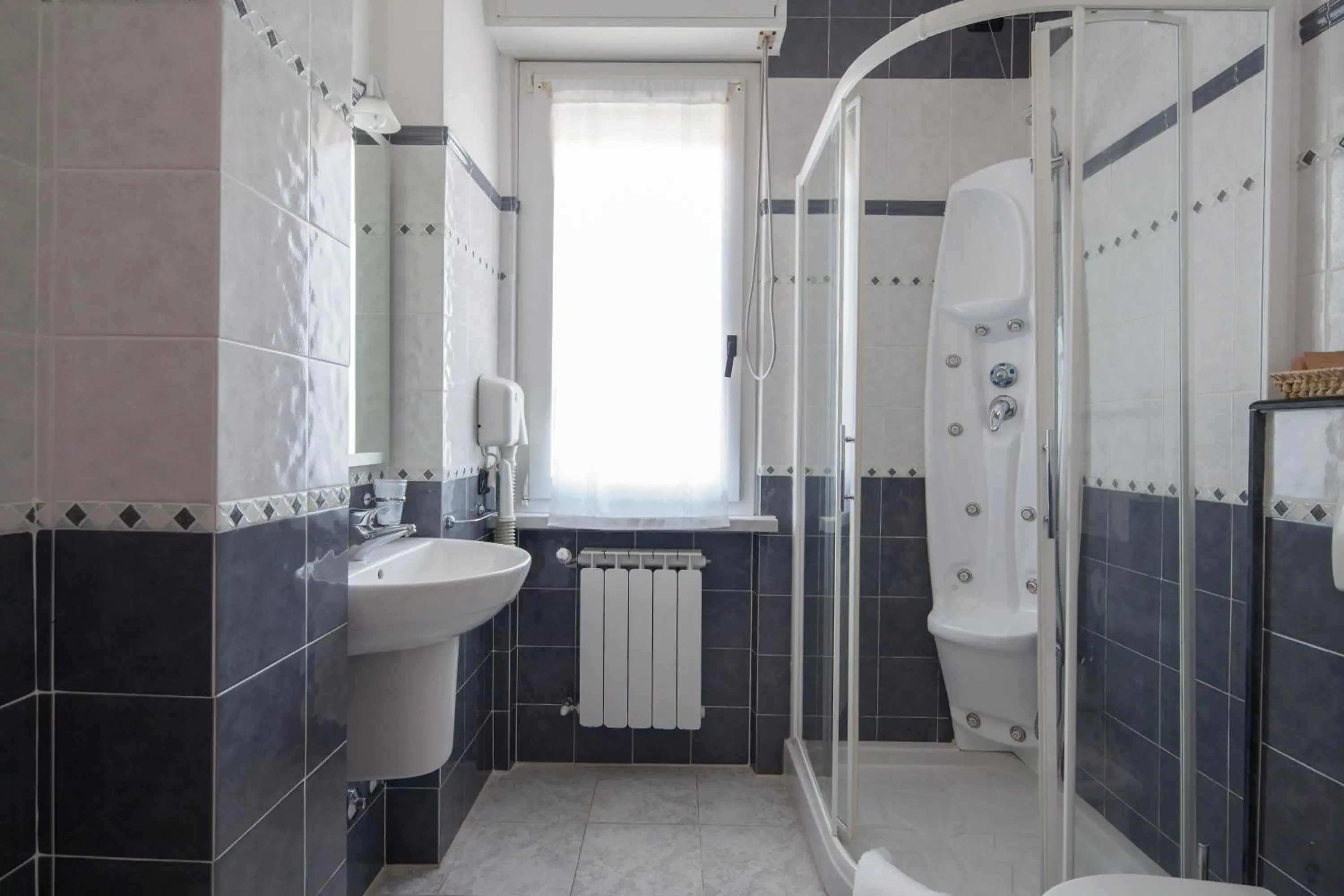 Shower, Bathroom in Hotel Nella