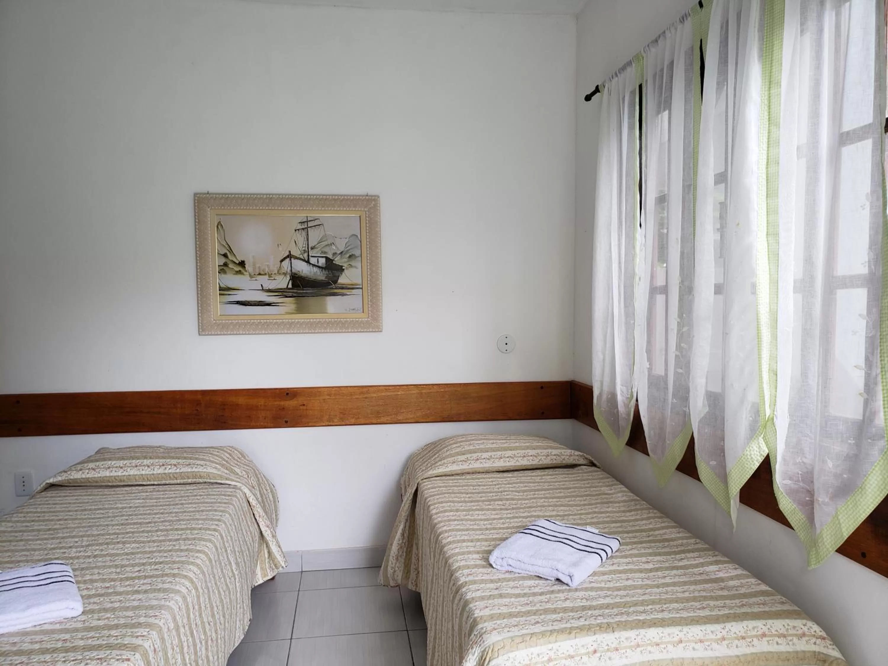 Bed in Pousada Recanto Das Emerências