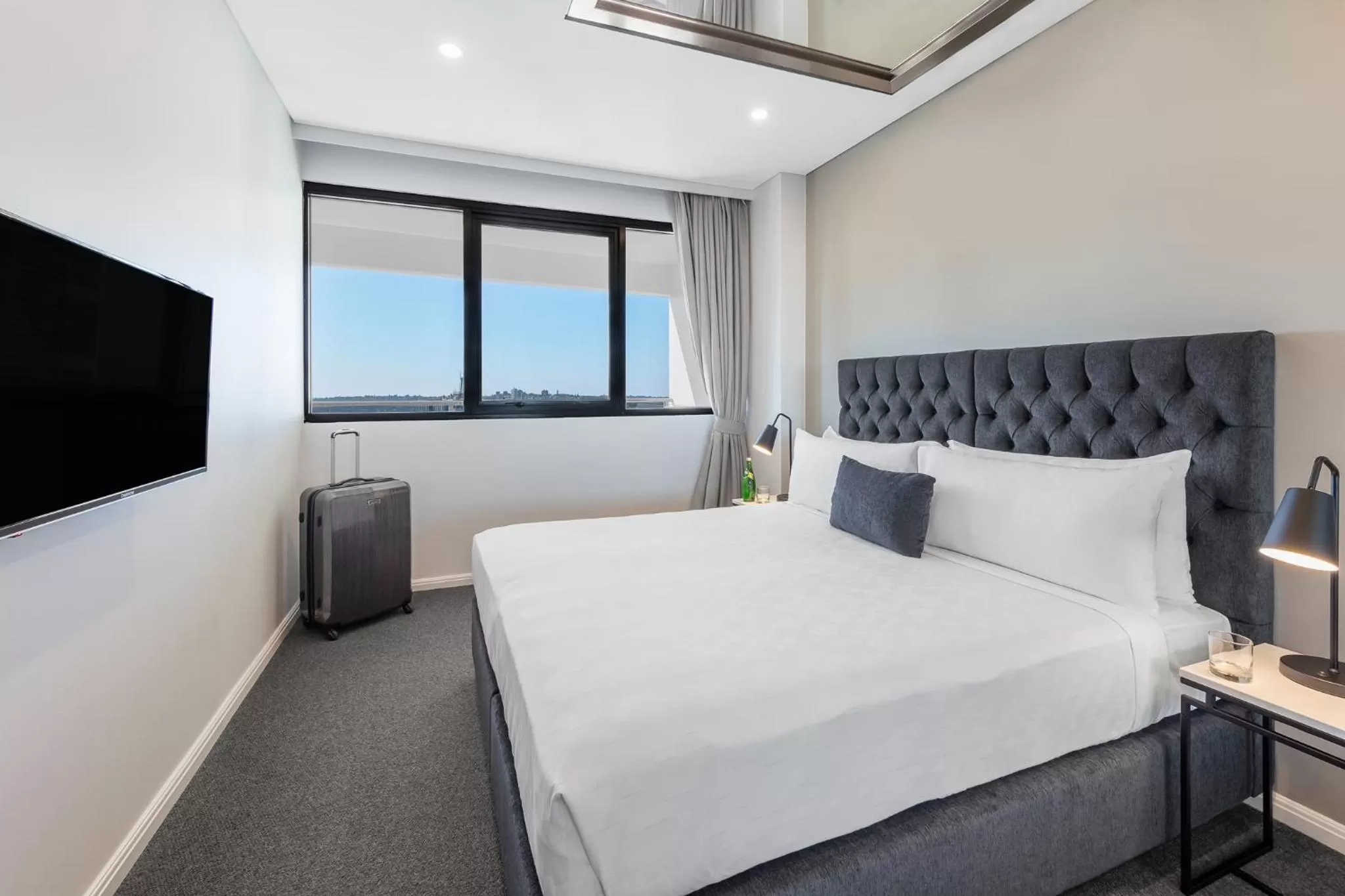 Bed in Meriton Suites Kent Street, Sydney
