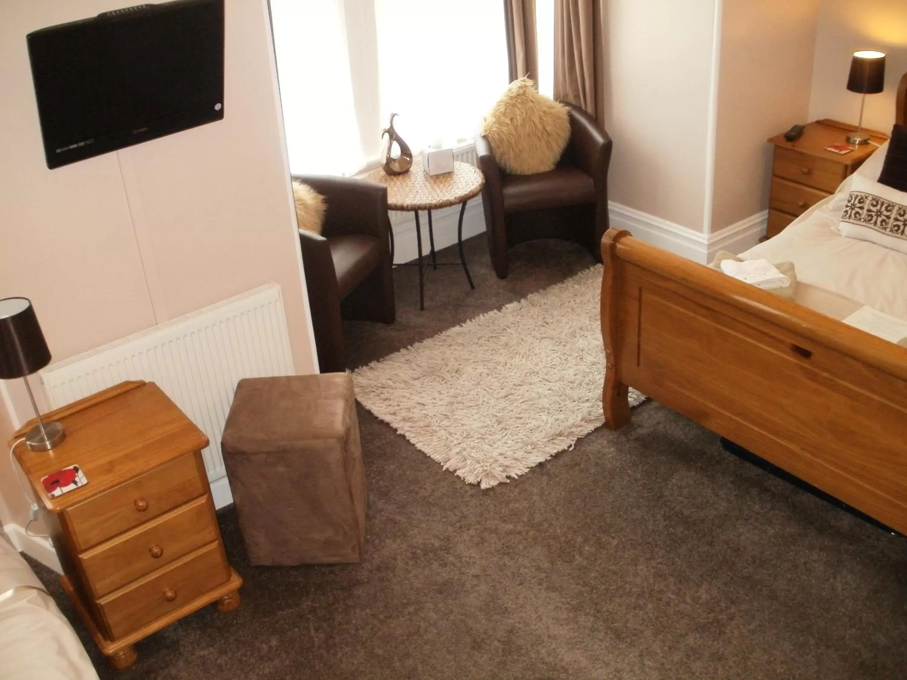 Bed, Seating Area in Chiverton House Guest Accommodation