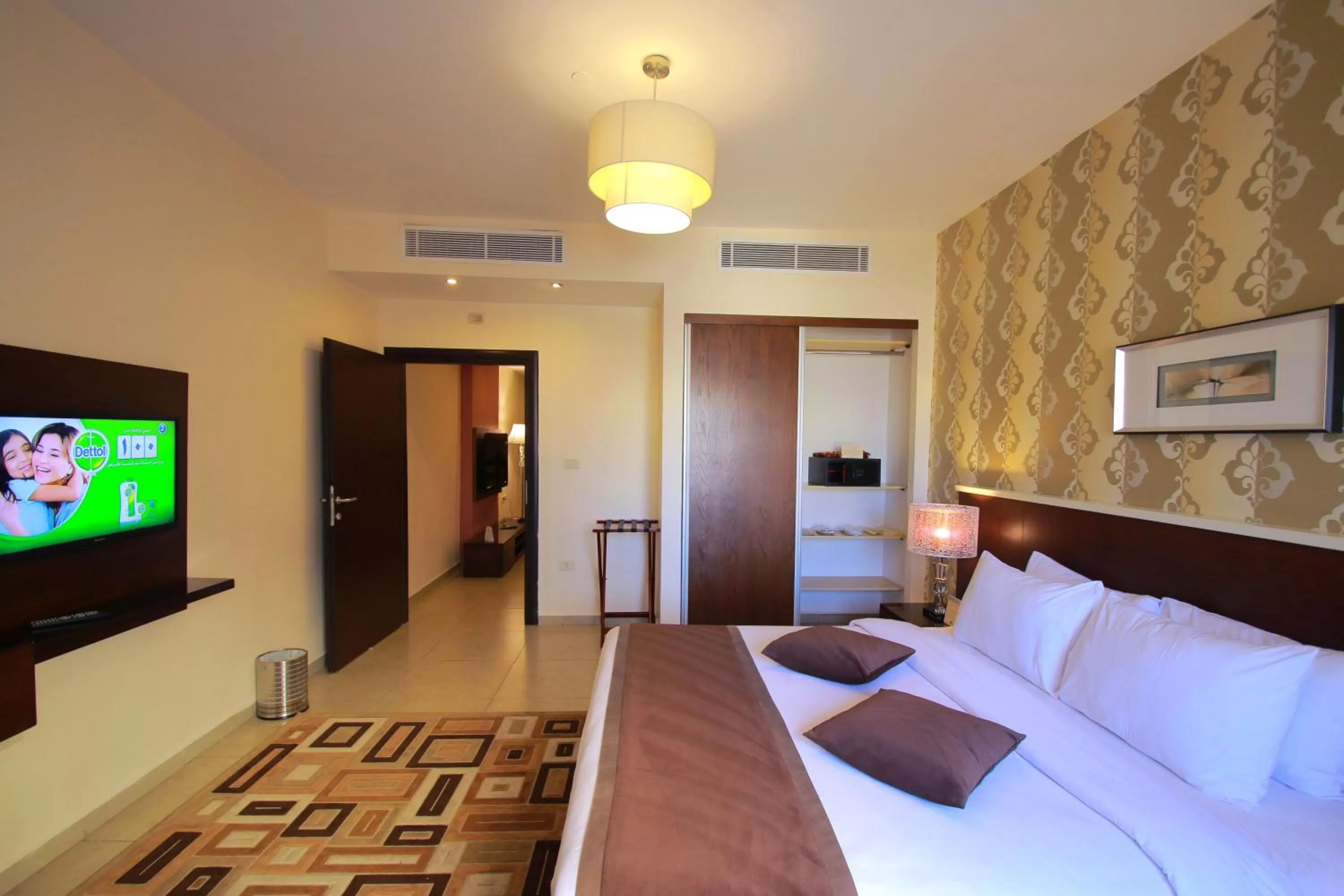 Bed in City Rose Hotel Suites